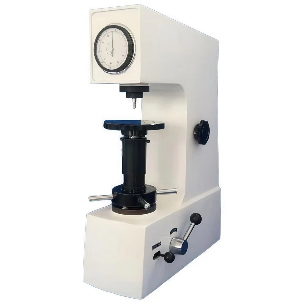 Laboratory Brinell hardness tester with a dial gauge, black stage, and adjustment knobs.