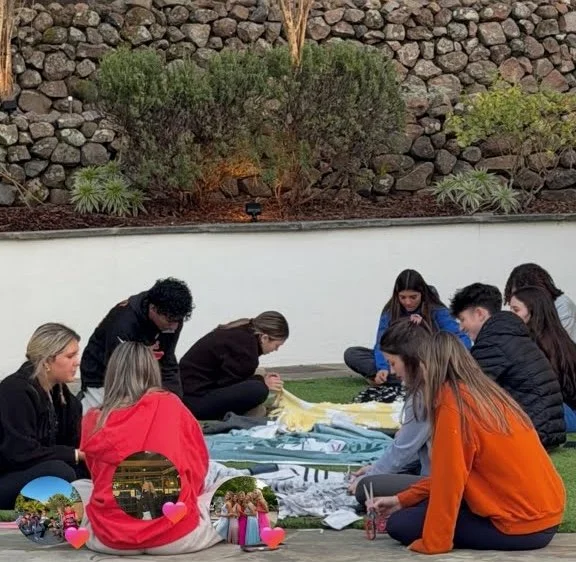 40+ kids making blankets 
