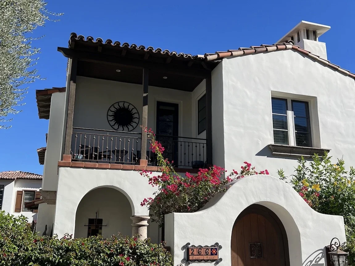 Spanish-style condo balcony railing with hammered balusters and decorative knuckles