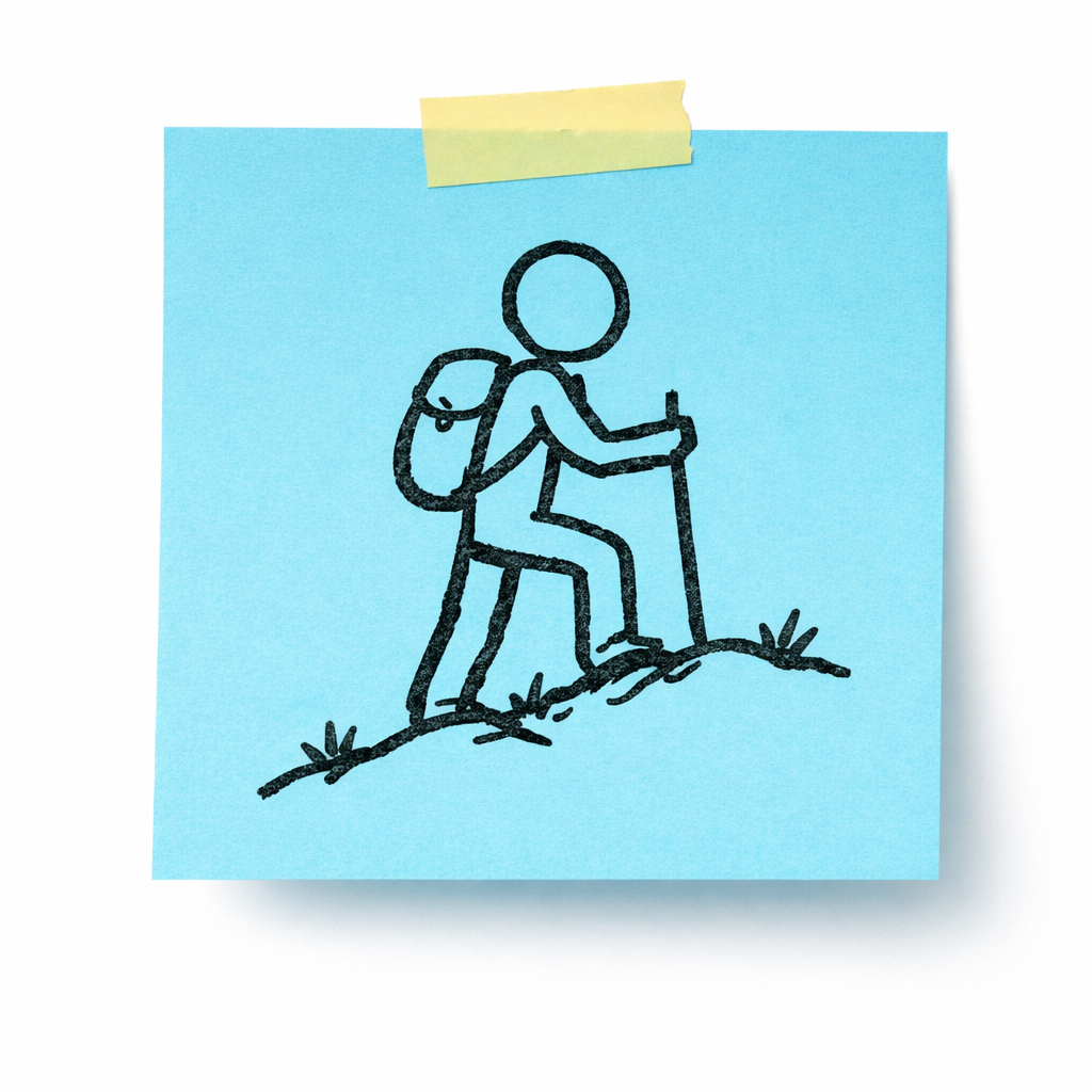 A sticky note with a drawing of a person hiking