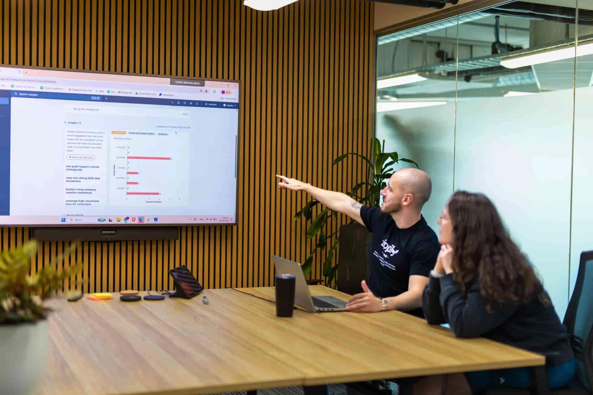Zippily advisor reviewing HubSpot AI-powered lead scoring setup with a client