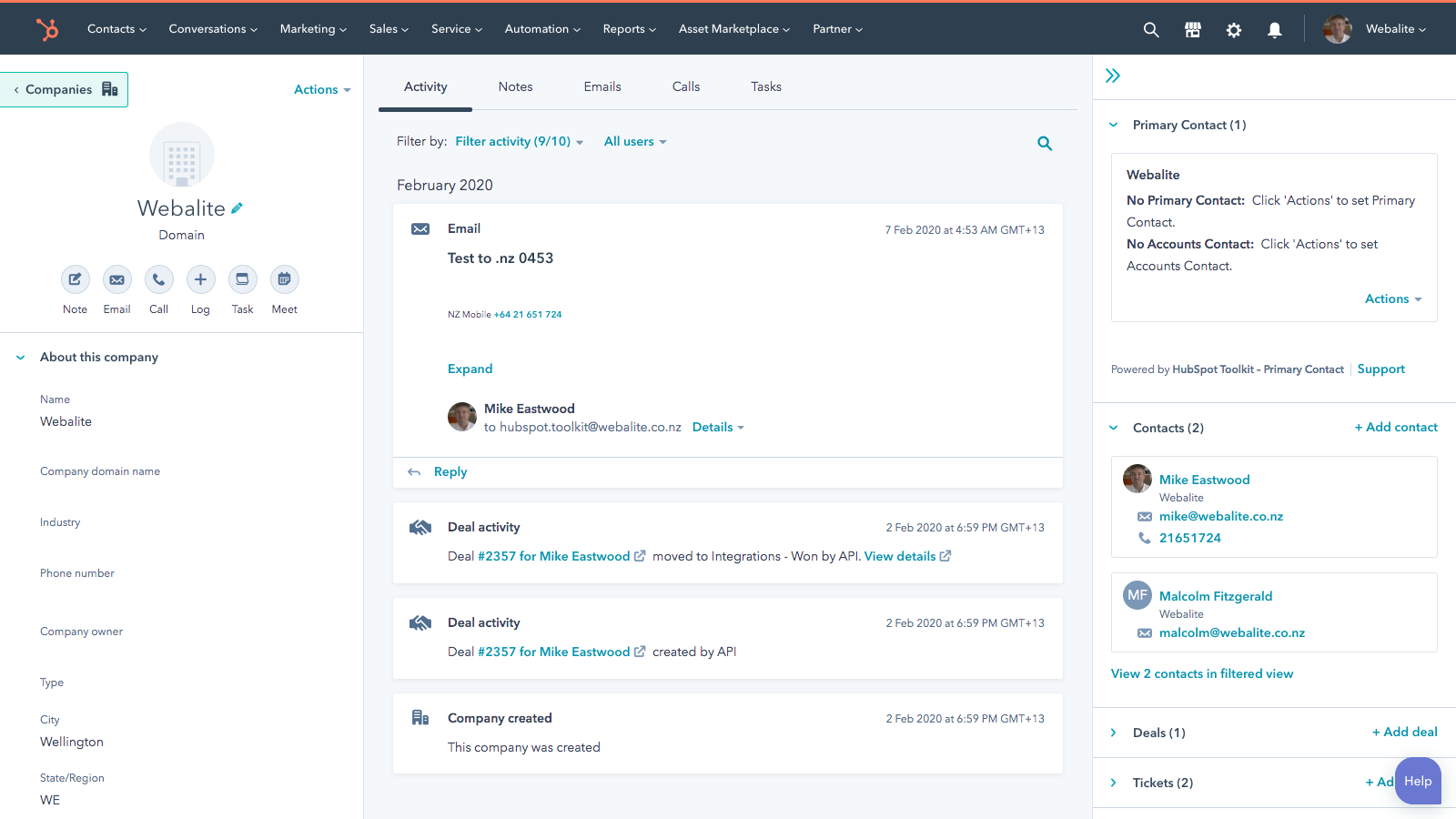 HubSpot CRM contact record showing activity timeline and deal updates, representing alignment between sales and marketing processes