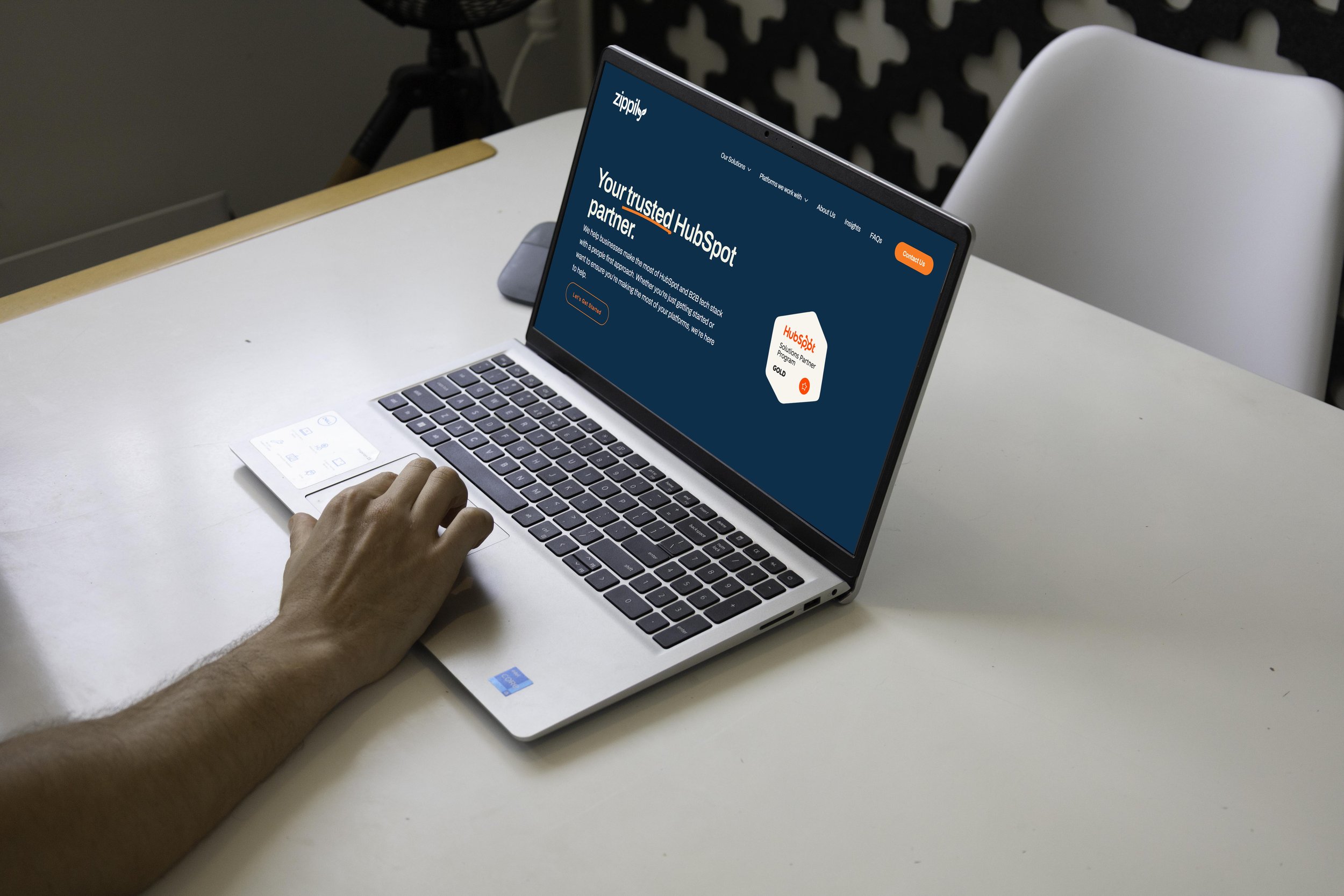 Using HubSpot CRM dashboard on a laptop for business implementation and setup.