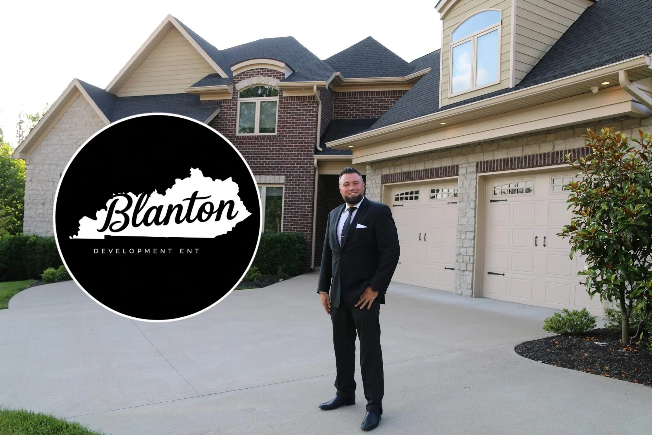 A man in a black suit standing in front of a large house with a driveway, garage, and well-maintained landscaping. There is a black and white logo with the outline of Kentucky and the word 'Blanton' on the left side of the image.