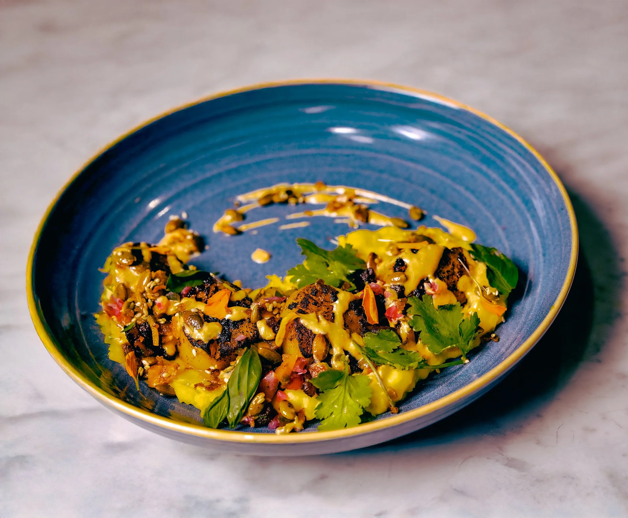 Hokkaido Scallops With Yucca, Sweet Platano, Plantain, and Berbere Sofrito Cream Sauce