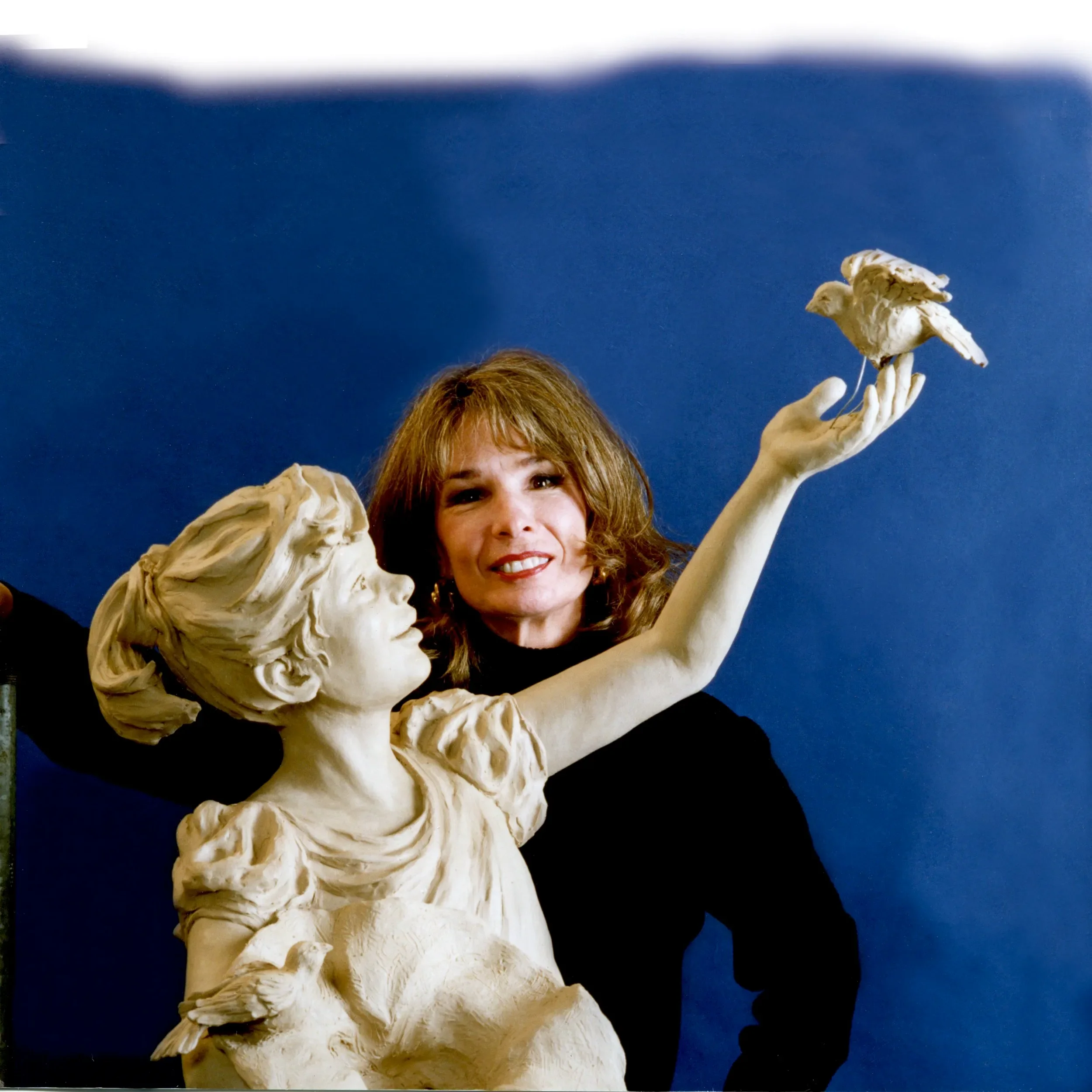 Rosalind working on clay, The Bird Feeder