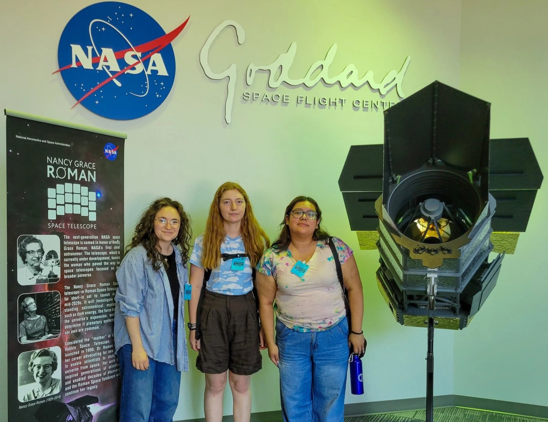 Julia Sherman'25, Alejandra Rodriguez'25, and Evyn Lally'27 in from the Roman Space Telescope model at the NASA Goddard.