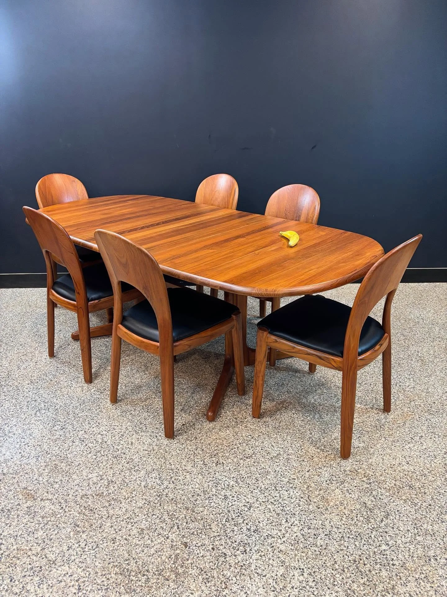Set of six restored 1970&rsquo;s Mid Century Danish Modern Niels Koefoed Morton teak chairs &amp; solid teak expanding pedestal dining table.⁣
⁣
Not an inch of veneer here; everything is solid teak. Fully restored and seats have been recovered in bla