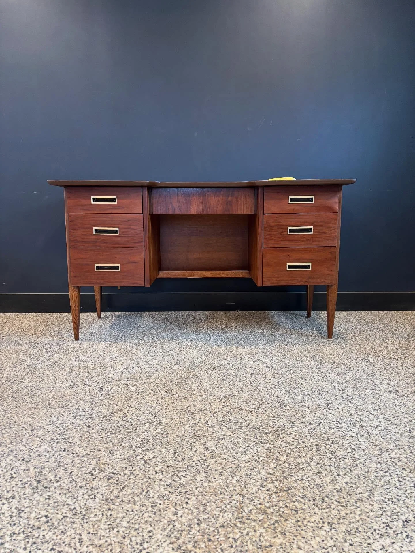 Restored vintage 1960&rsquo;s Mid Century Modern Hooker by Mainline walnut executive desk. ⁣
⁣
Finished back and drawers glide smoothly. ⁣
⁣
Banana for scale. ⁣
⁣
53.5 W x 25 D x 29.5 H⁣
Kneehole 20 W x 24.5 H⁣
⁣
Pick-up in Beverly, MA or local deliv