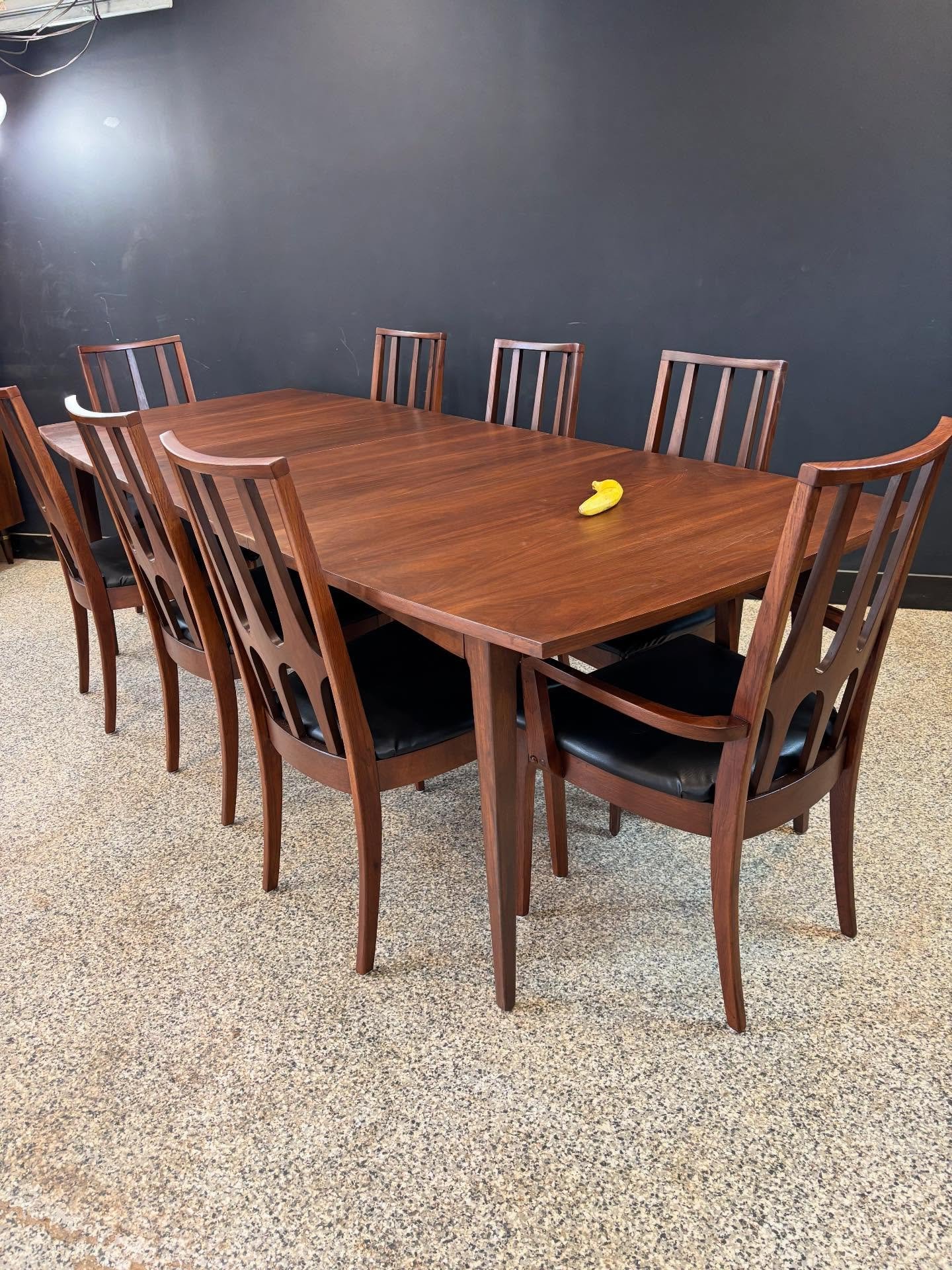 [sold] Restored vintage 1960&rsquo;s Mid Century Modern Broyhill Brasilia walnut expanding surfboard dining table &amp; eight chairs. ⁣
⁣
Table has three leaves, one with the apron and two without. Chairs are six sides and two captains. ⁣
⁣
Chair joi