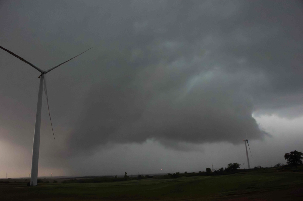 A supercell displaying what’s known as a wall cloud, as photographed by me during a storm chase in southwest Oklahoma. Because they can presage a tornado, these formations are of key interest to researchers.