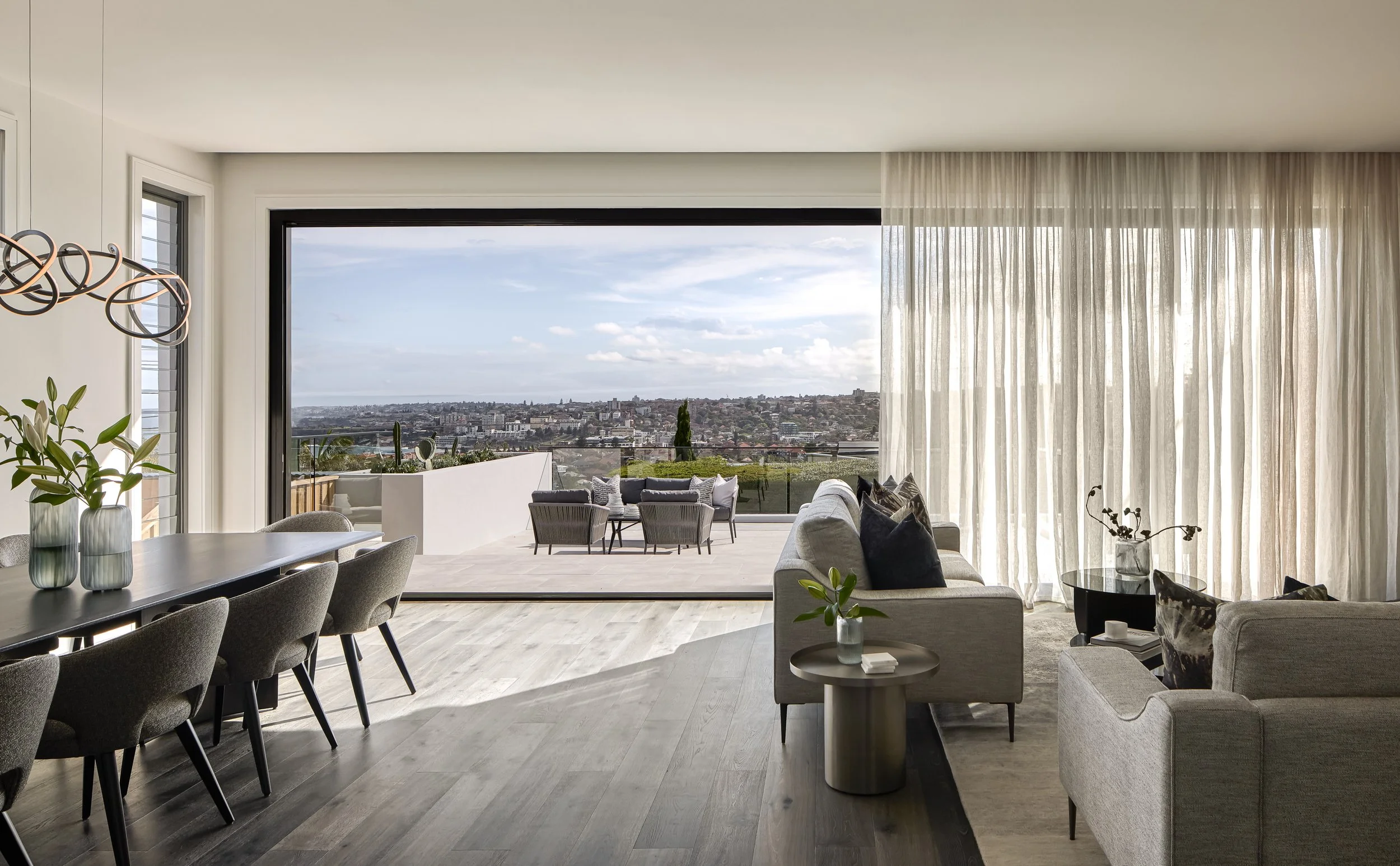 Formal living room with ocean views and outdoor area by Mandy Alice, Byron Bay interior designer — Dover Heights Sydney.