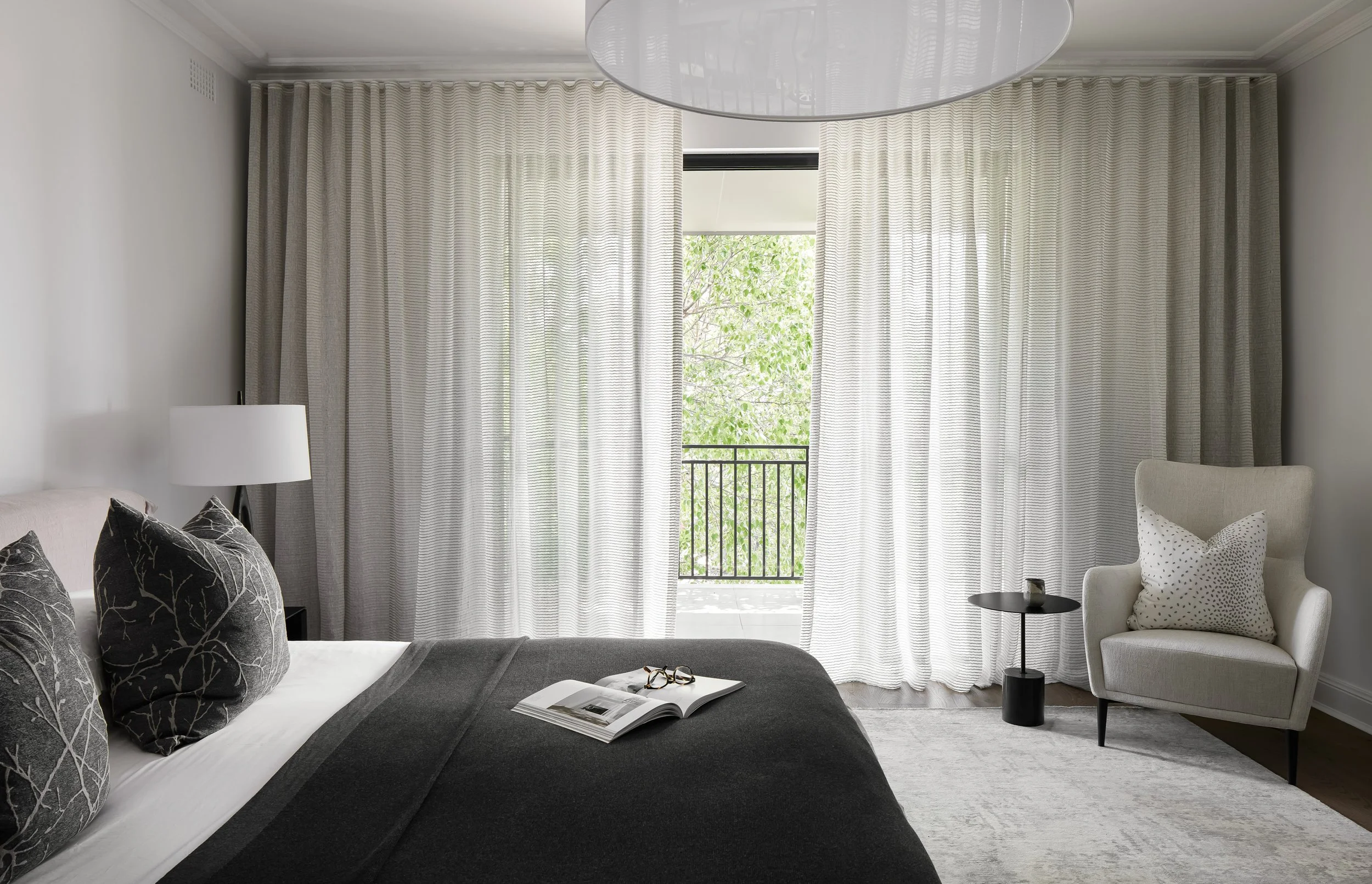 Sophisticated bedroom interior featuring bespoke bedding, layered textiles, and soft ambient lighting, showcasing the signature interior styling of Mandy Alice in the Byron Bay Hinterland