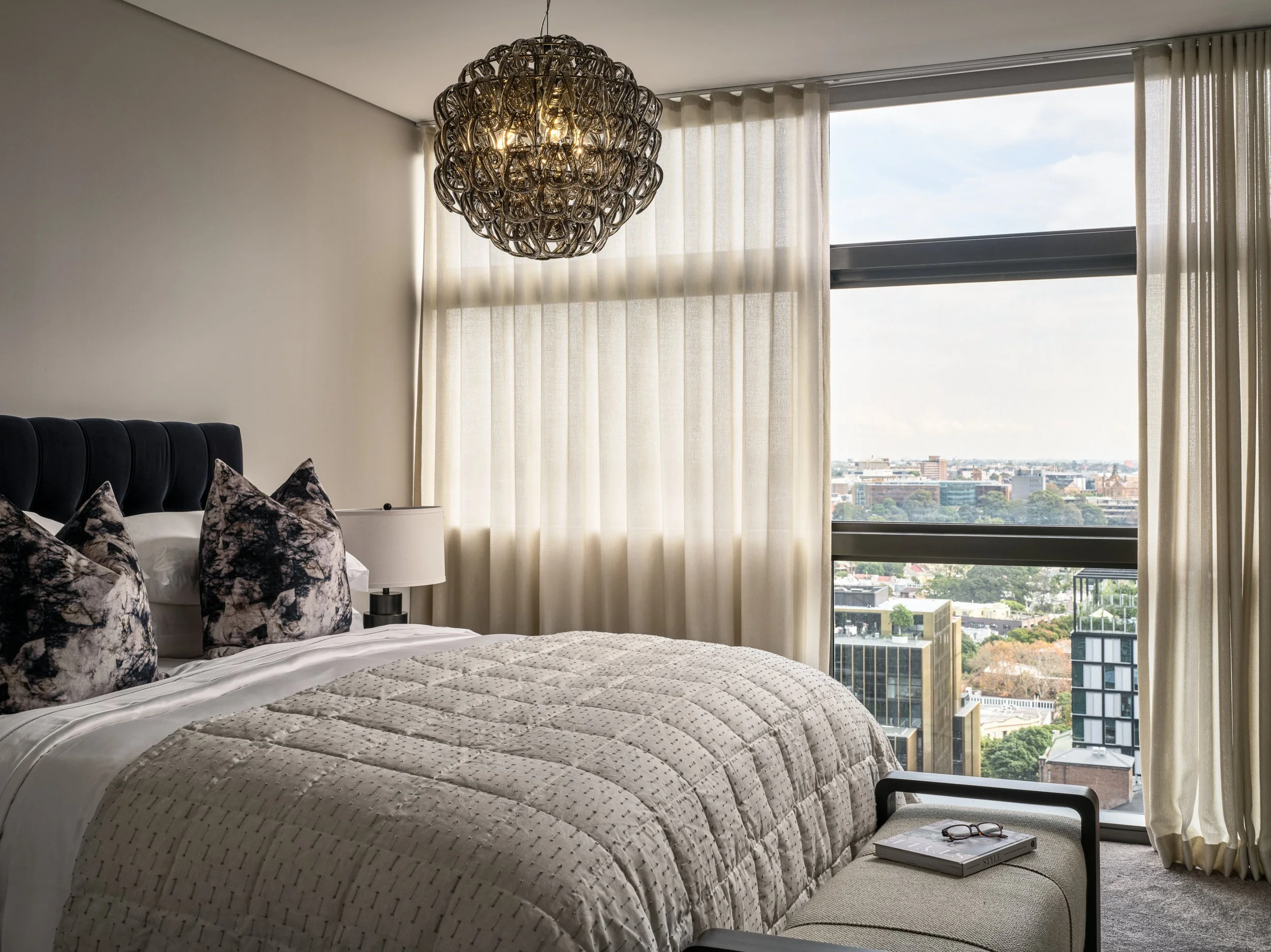 Luxury penthouse master bedroom with Sydney city views by Mandy Alice, Byron Bay interior designer — bespoke furnishing, Chippendale Sydney.