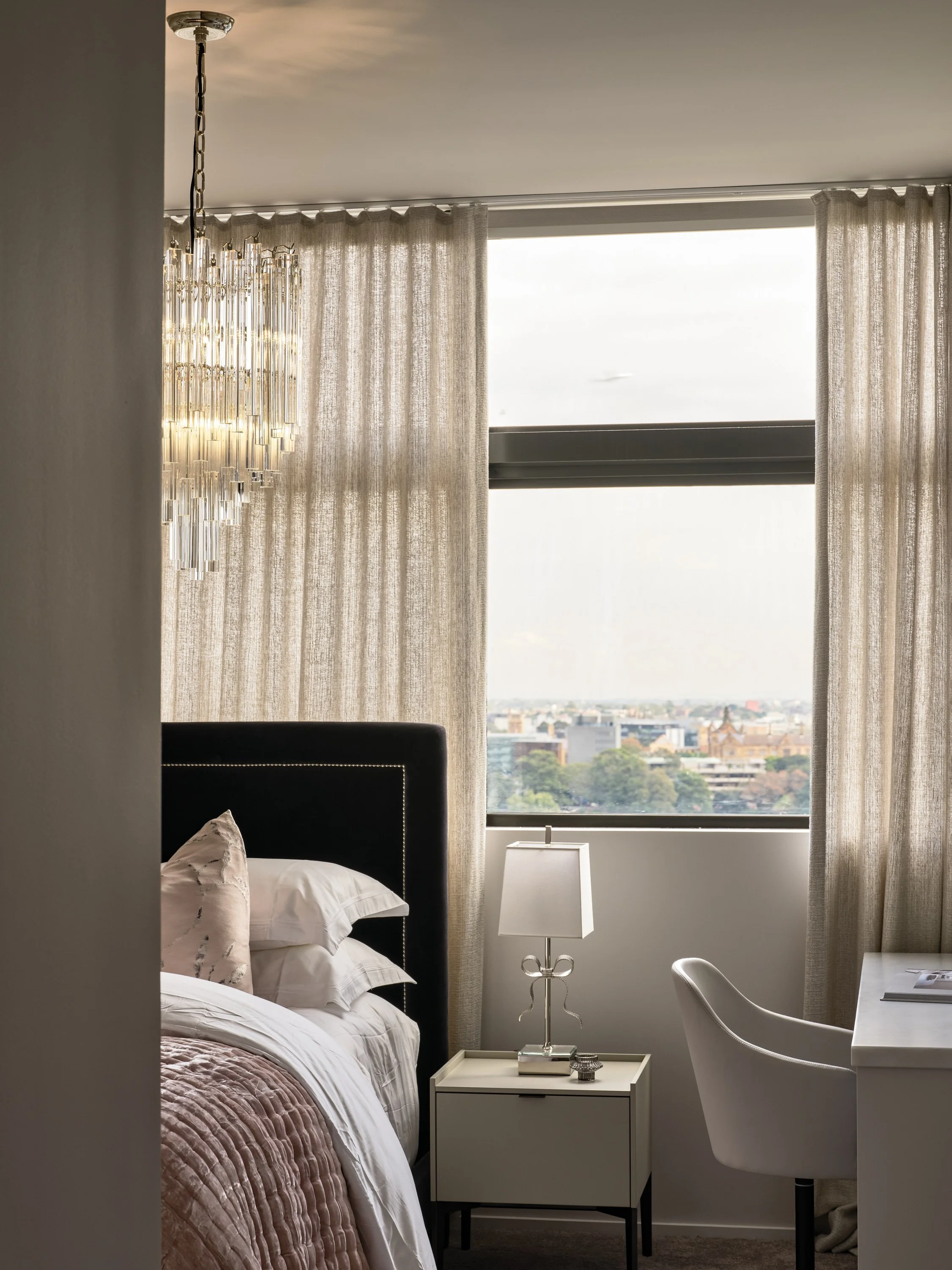 Penthouse bedroom with fireplace and city views by Mandy Alice, Byron Bay interior designer — considered styling, Chippendale Sydney.