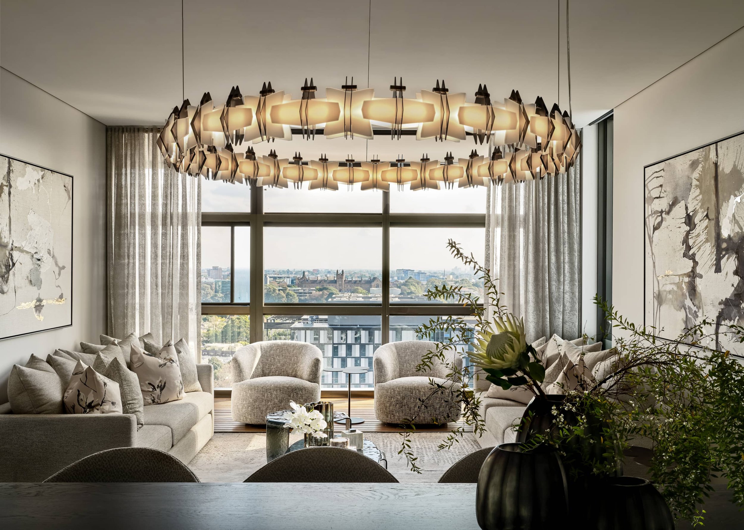 Luxury residential living room with statement chandelier and floor-to-ceiling windows by Mandy Alice Interior Design