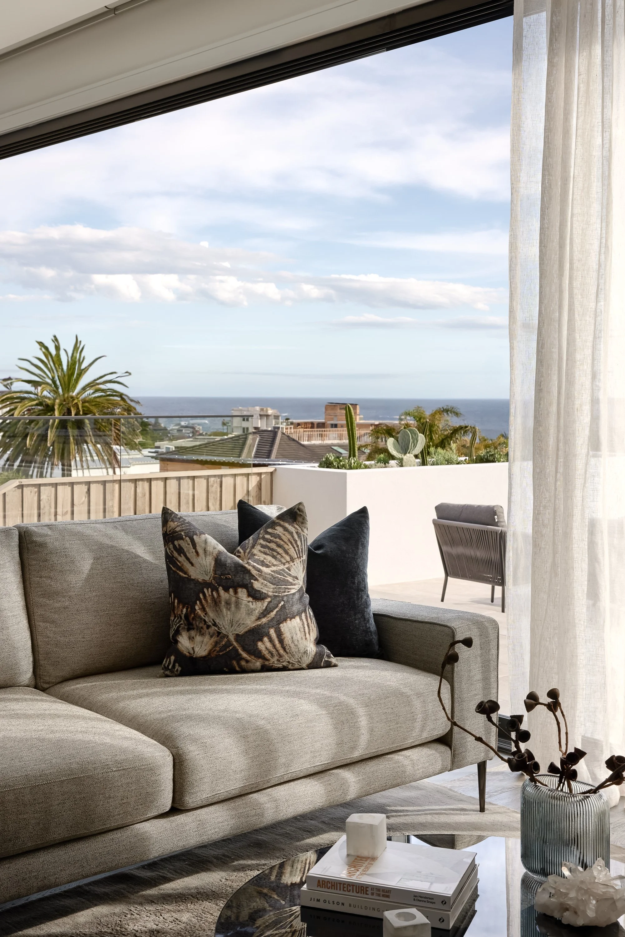 Outdoor terrace with harbour views styled by Mandy Alice, Byron Bay interior designer — full home renovation Dover Heights Sydney.