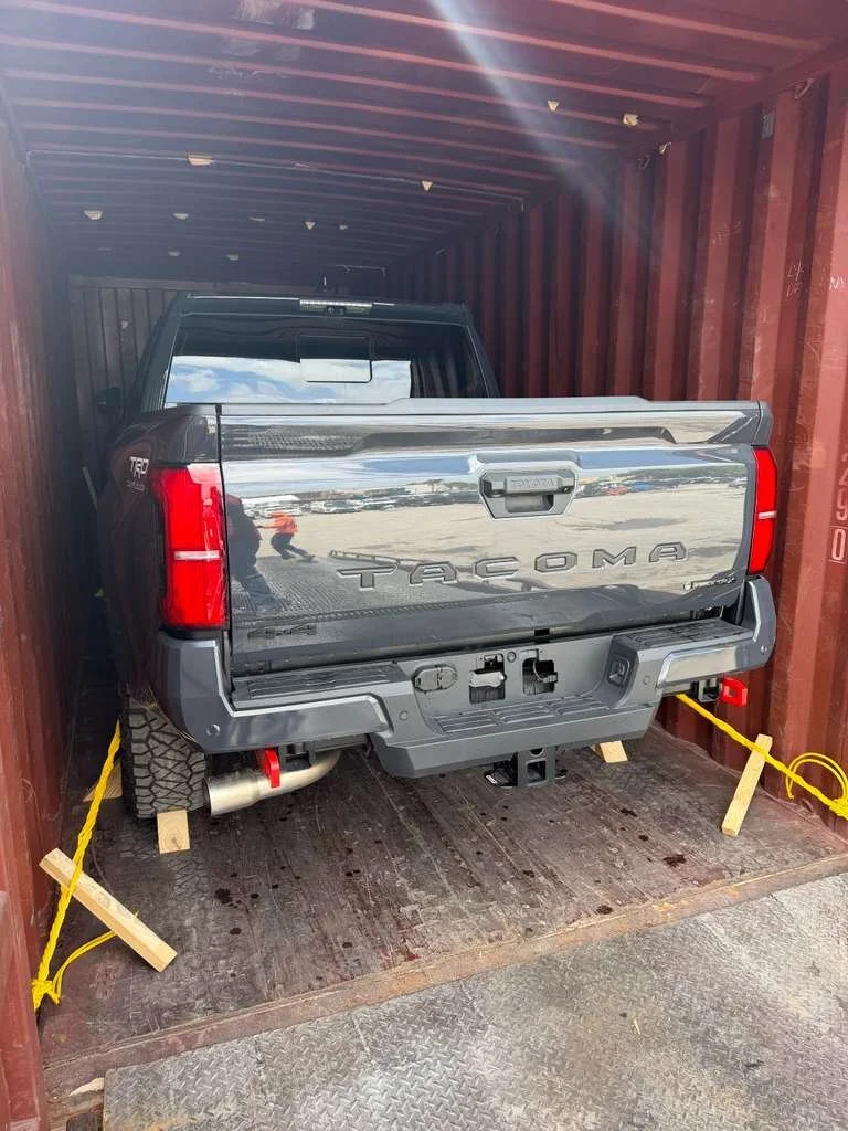 Cars secured inside shipping container for shipping to Guatemala