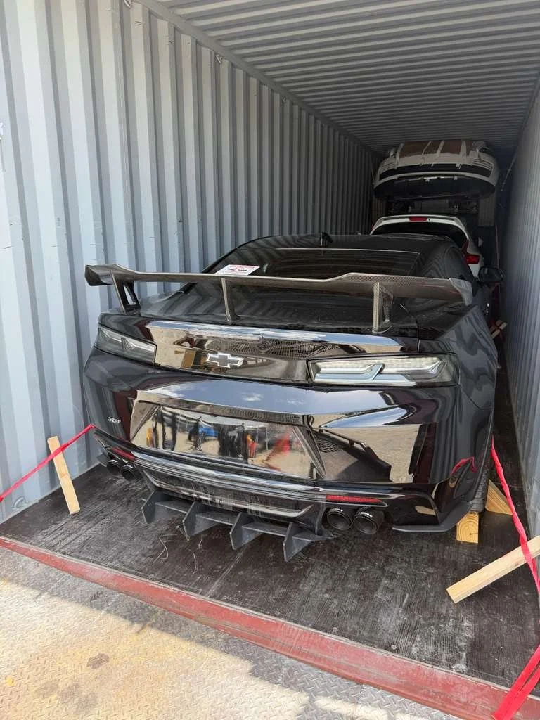 High-performance sports cars prepared for container and RoRo shipping to Nigeria from the United States.