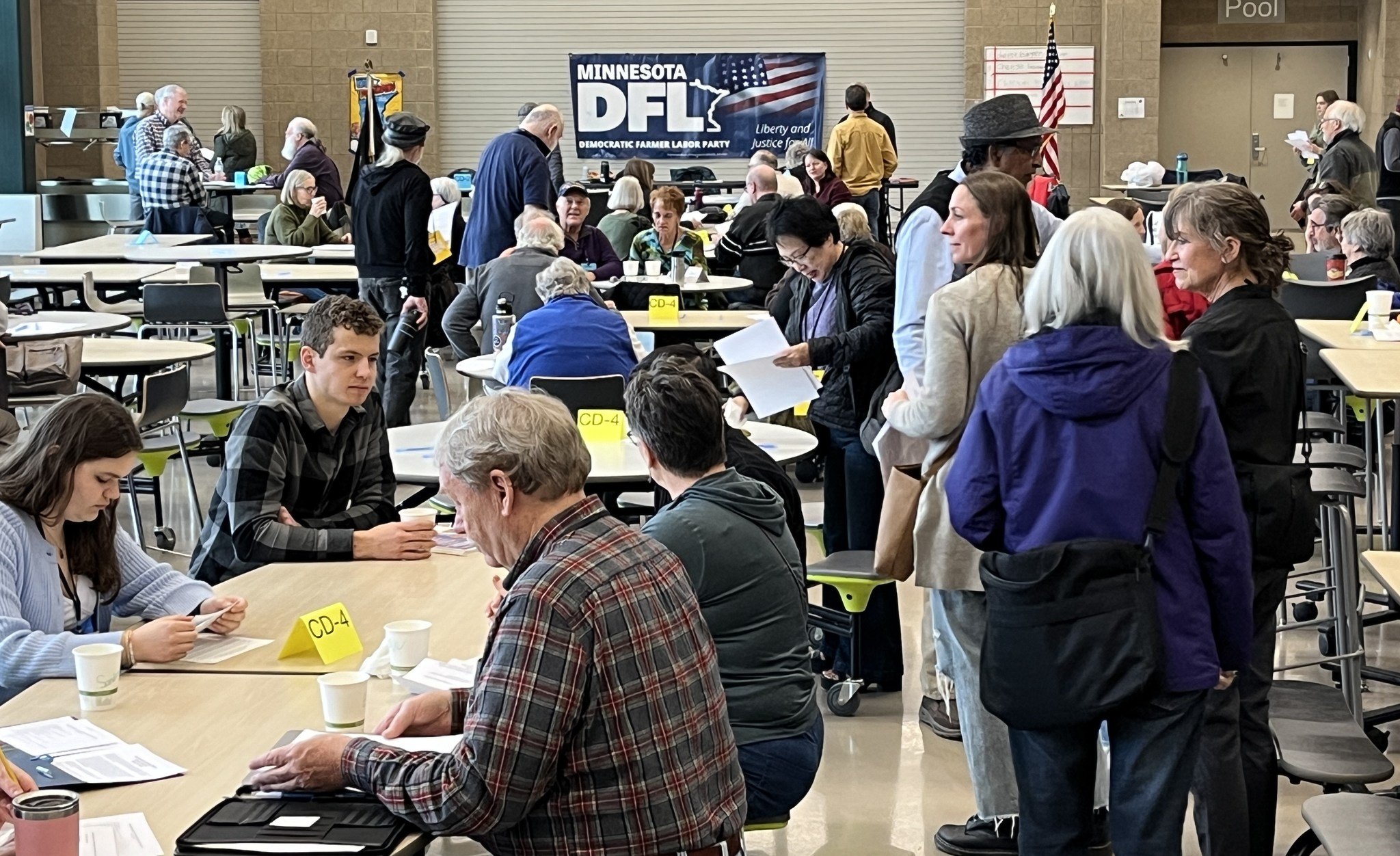 DFL caucus group shot with DFL sign in background. .jpg