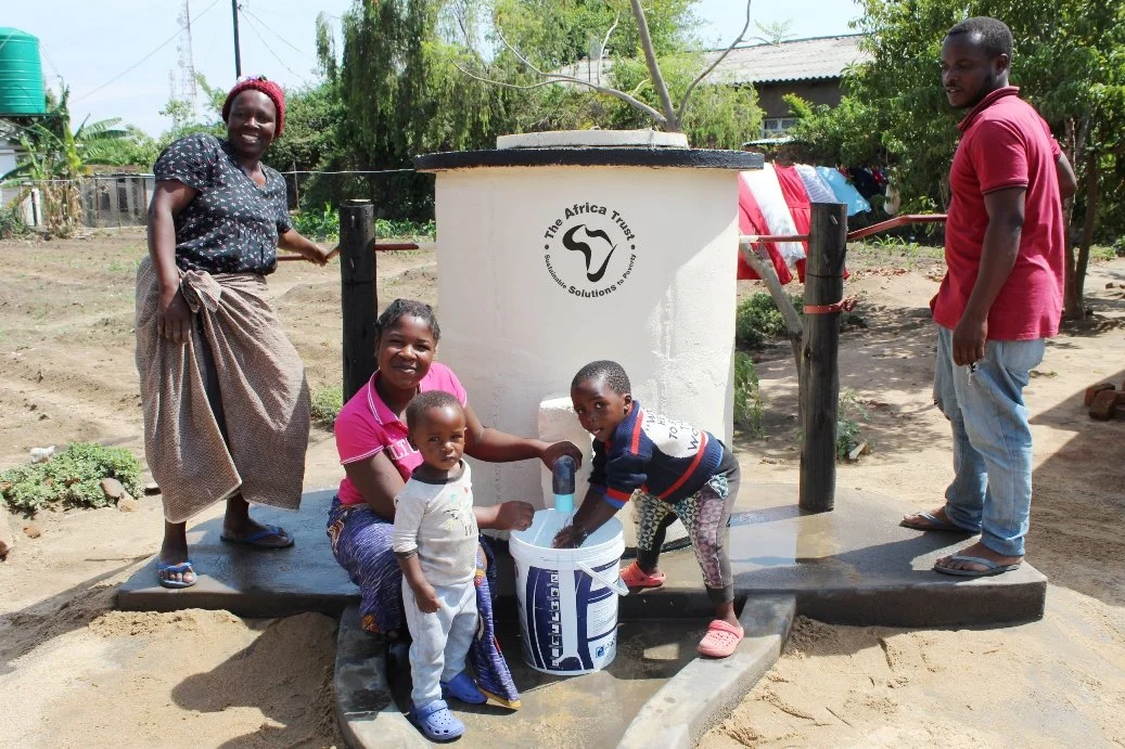 ATLogo-E-Women-Man-and-Small-Children-at-Elephant-Pump.jpg