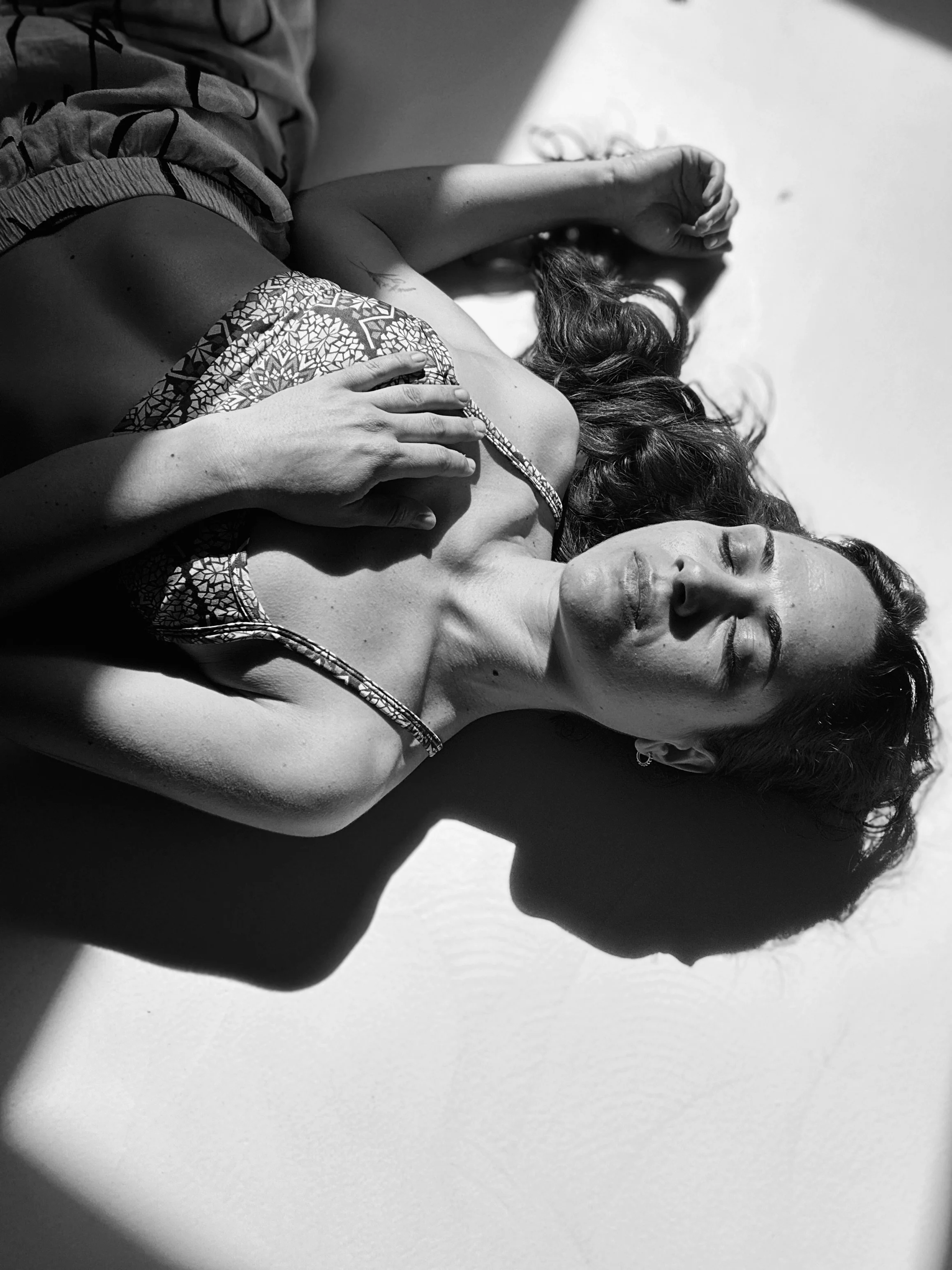 woman relaxing closed eyes hand on her heart breathing soft breath