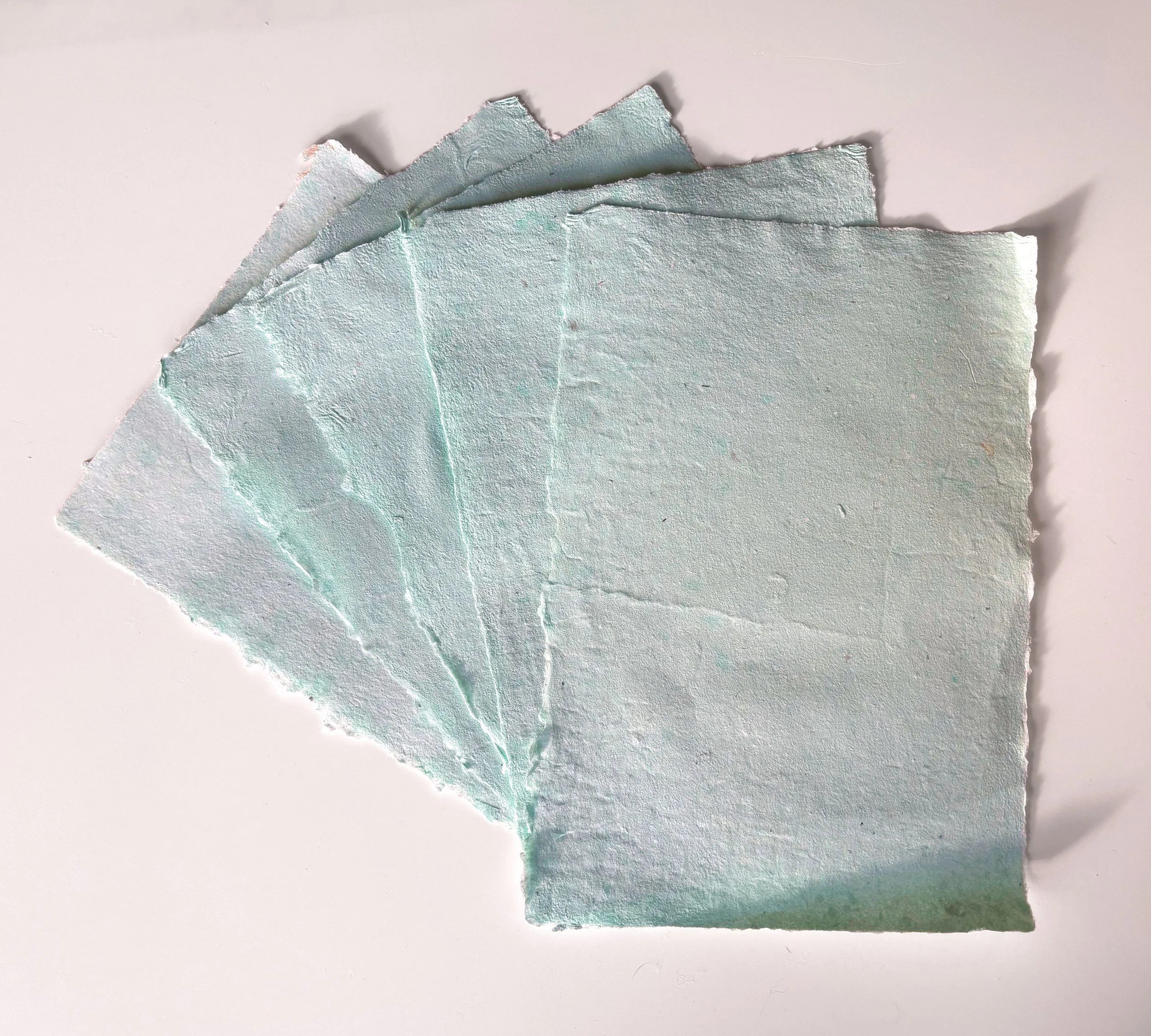 Recycled Teal Paper- 
Recycled prints and cotton linters, Twinrocker aqueous pigments, methyl cellulose, retention aid, 
8” x 12”, 
2025