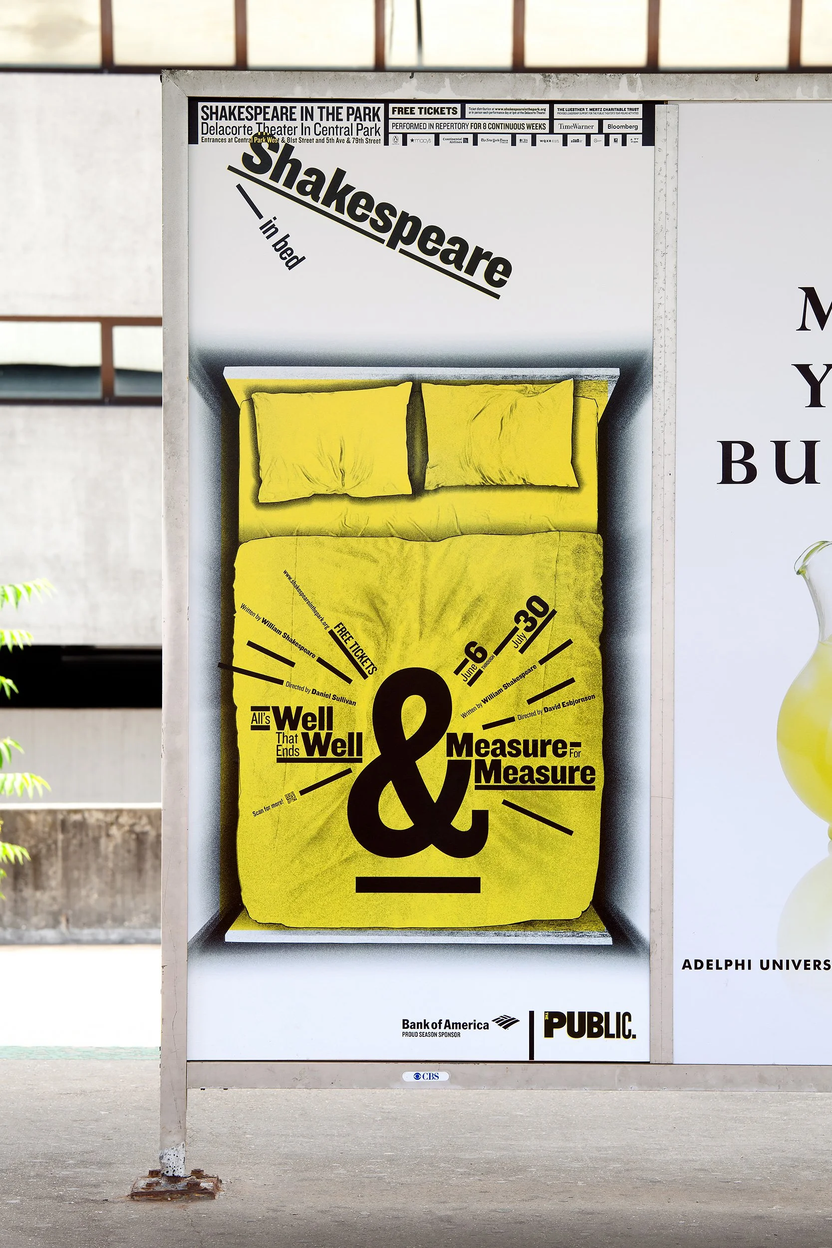 A street poster advertising a Shakespeare play called "All's Well That Ends Well" at Delacorte Theater in Central Park. The poster features a yellow bed with two pillows and a large black ampersand symbol, with details about the performance dates, sponsors, and ticket information.