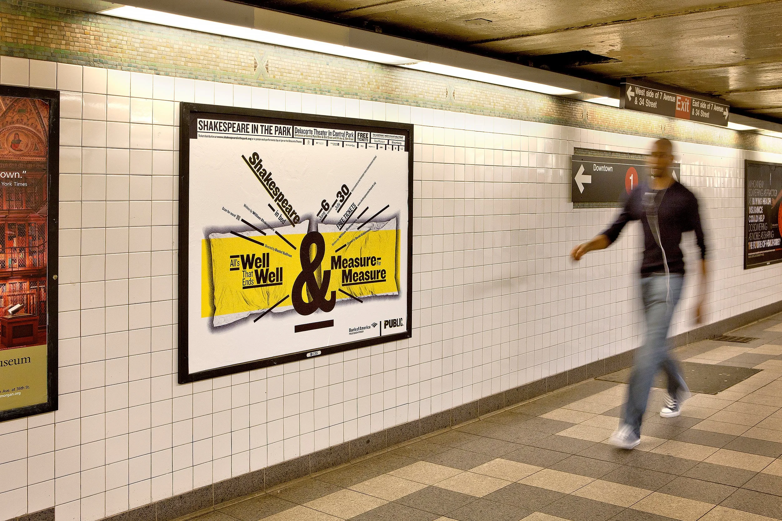 Underground subway station with a person walking past tiled walls, advertising posters, and directional signs for downtown and exit.