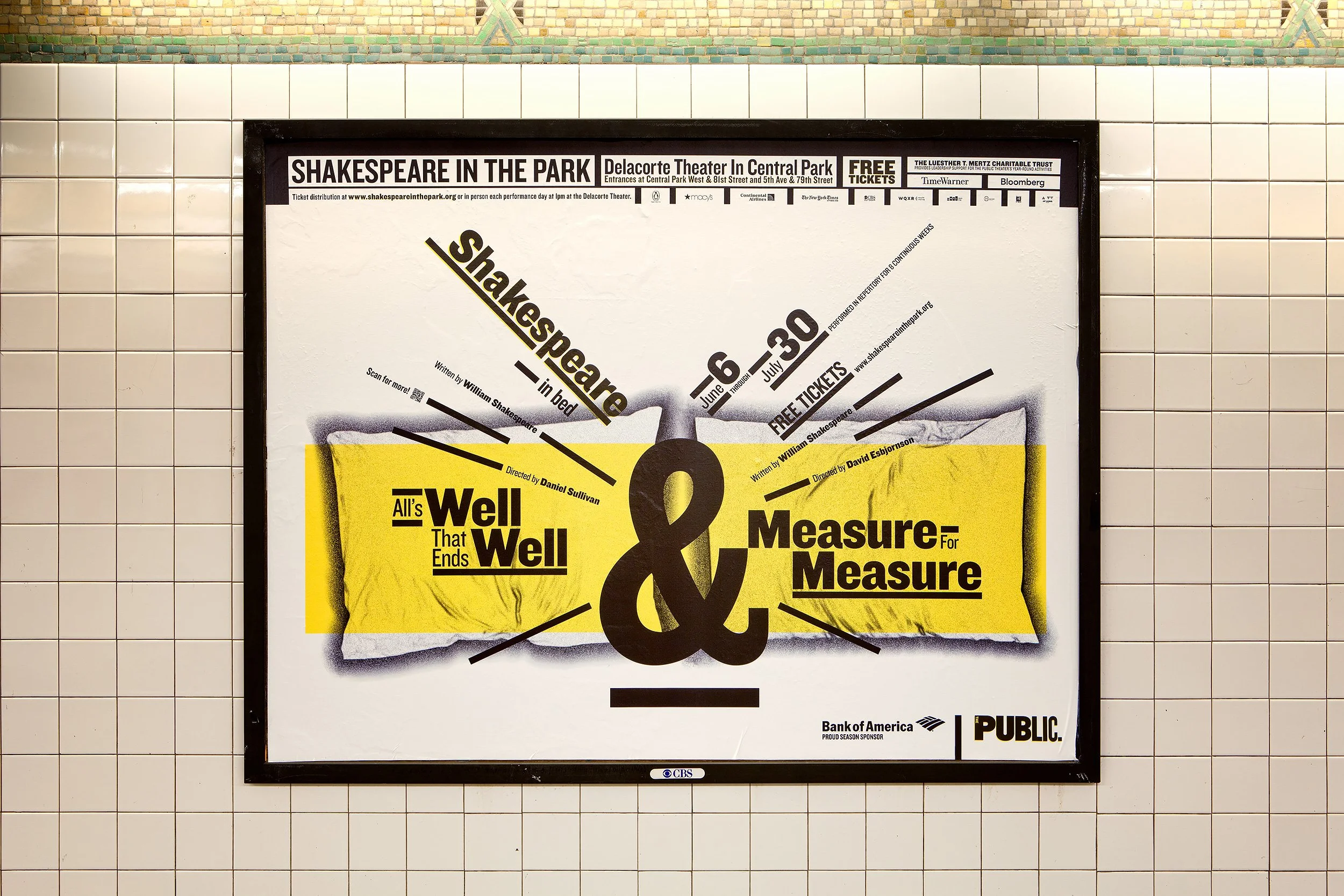 A subway or train station poster advertising a Shakespeare in the Park production of 'All's Well That Ends Well,' scheduled from June 6 to July 30, with details about tickets, author William Shakespeare, director Daniel Sullivan, and sponsors such as Bank of America and CBS. The poster features a yellow background and black text, surrounded by white tiled walls.