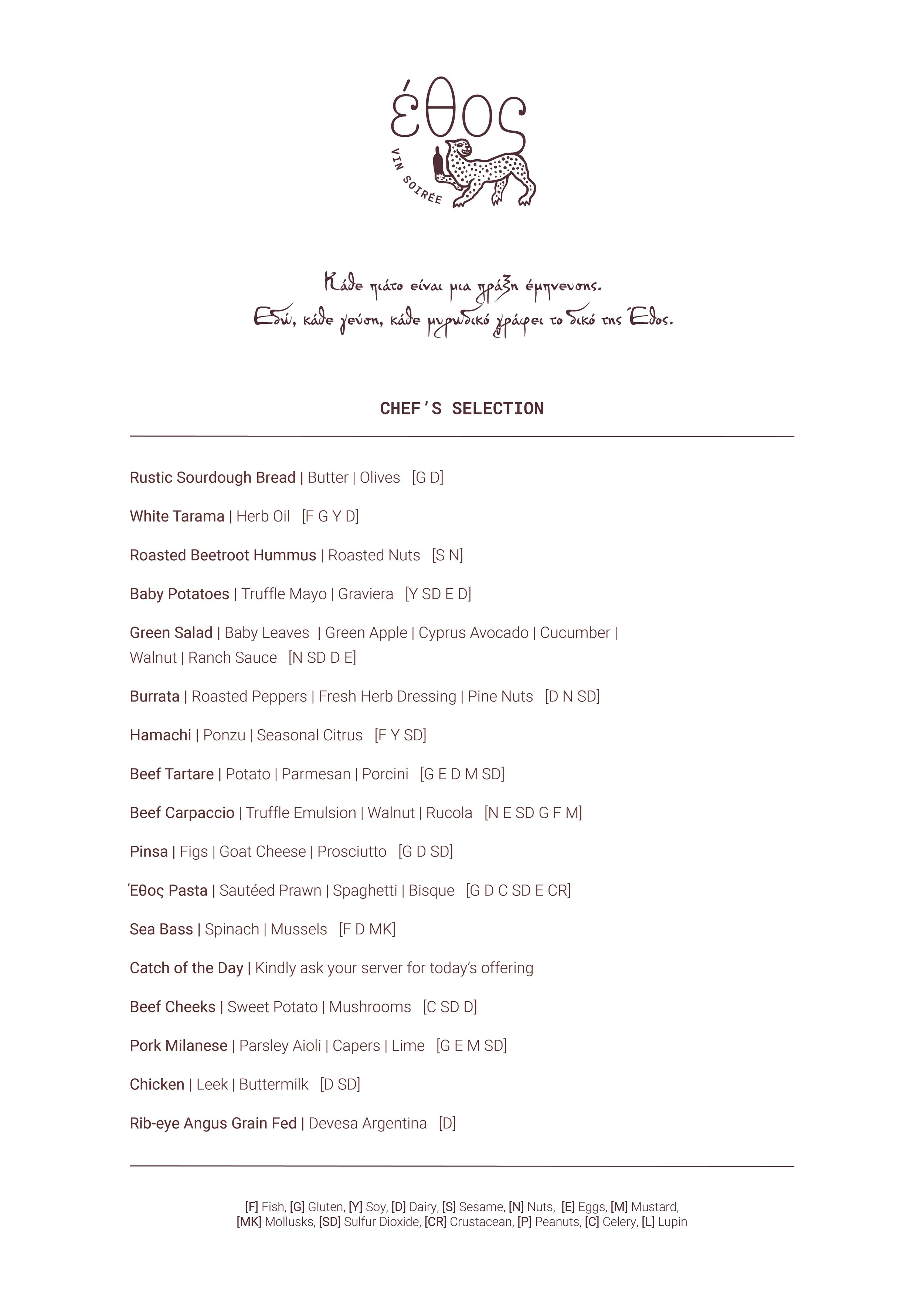 A Greek-themed restaurant menu featuring chef's dishes, including rustic bread, tarama, beetroot hummus, baby potatoes, green salad, burrata, hamachi, beef tartare, carpaccio, pasta, seafood, meats, and various sides, with symbols indicating ingredients and dietary info.