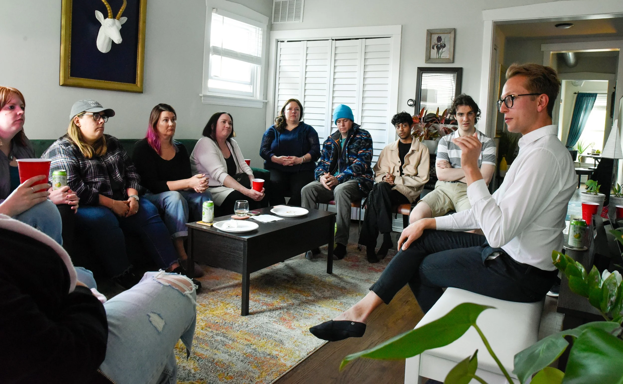 Nick at a salon, talking to neighbors