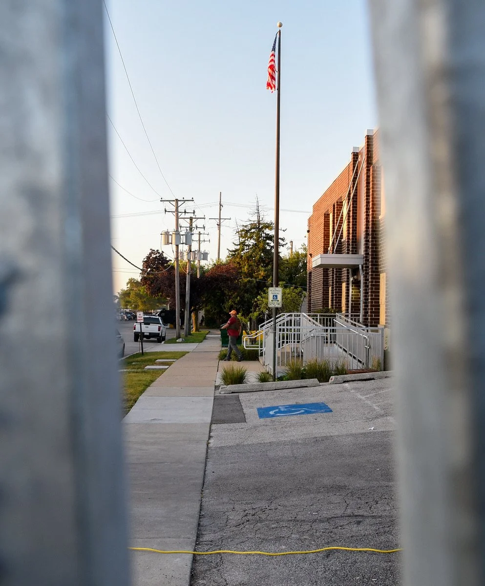Looking through the fence at someone walking out of the Broadview facility