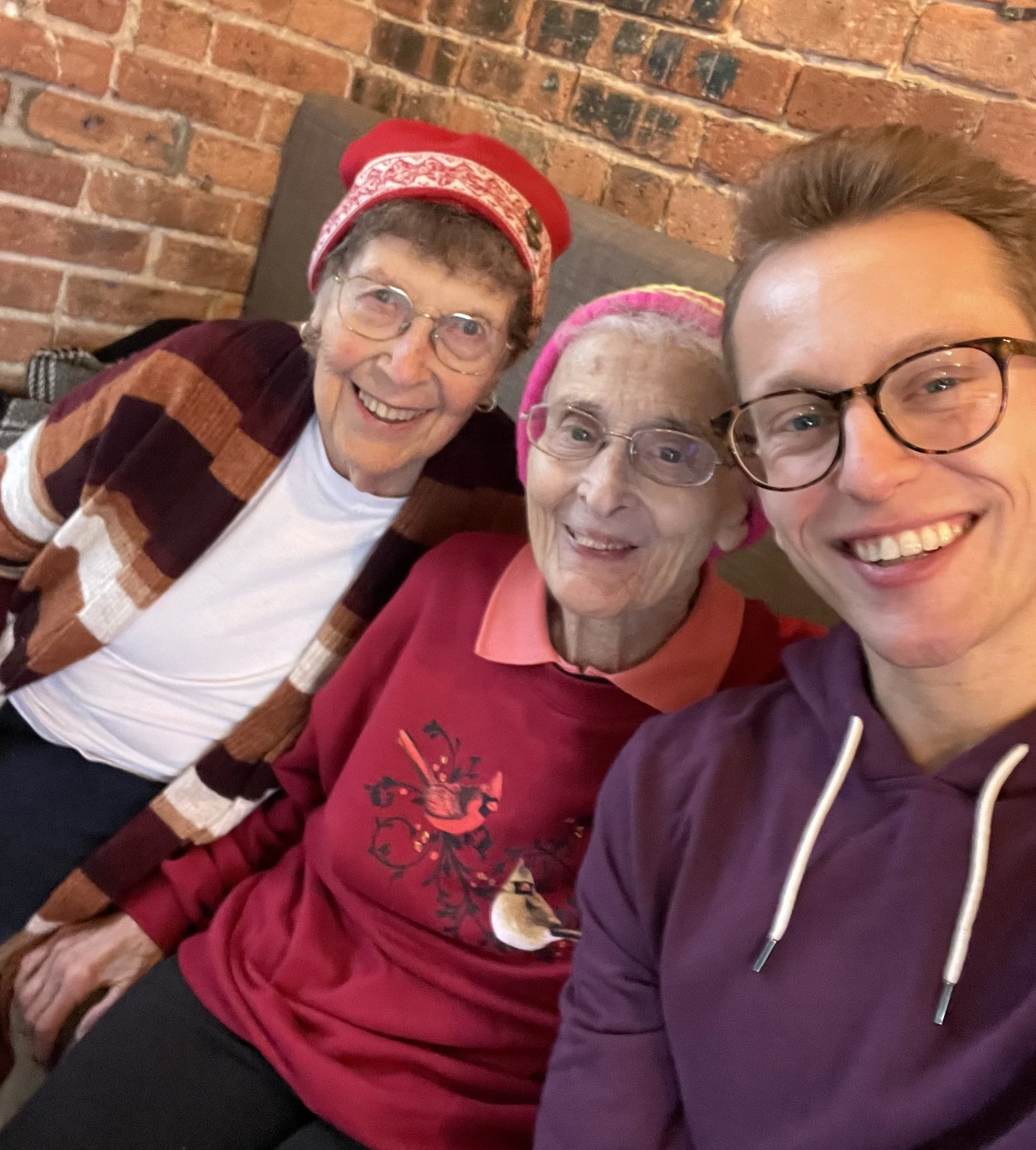 Nick smiling with Sister Pat and Sister JoAnn