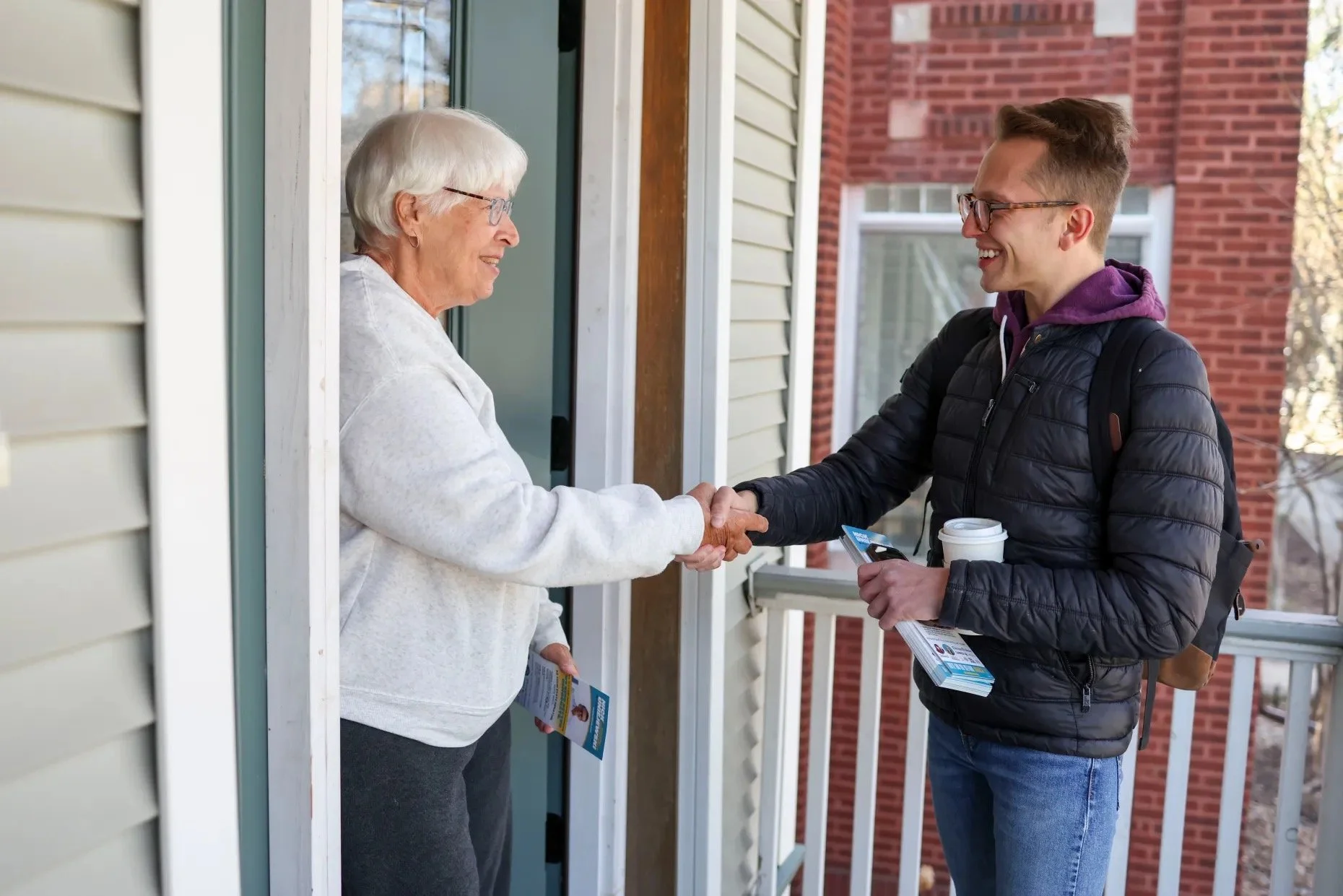 Nick greeting a voter at the door