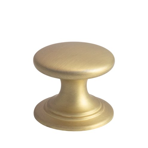 Gold cabinet knob with rounded design on white background