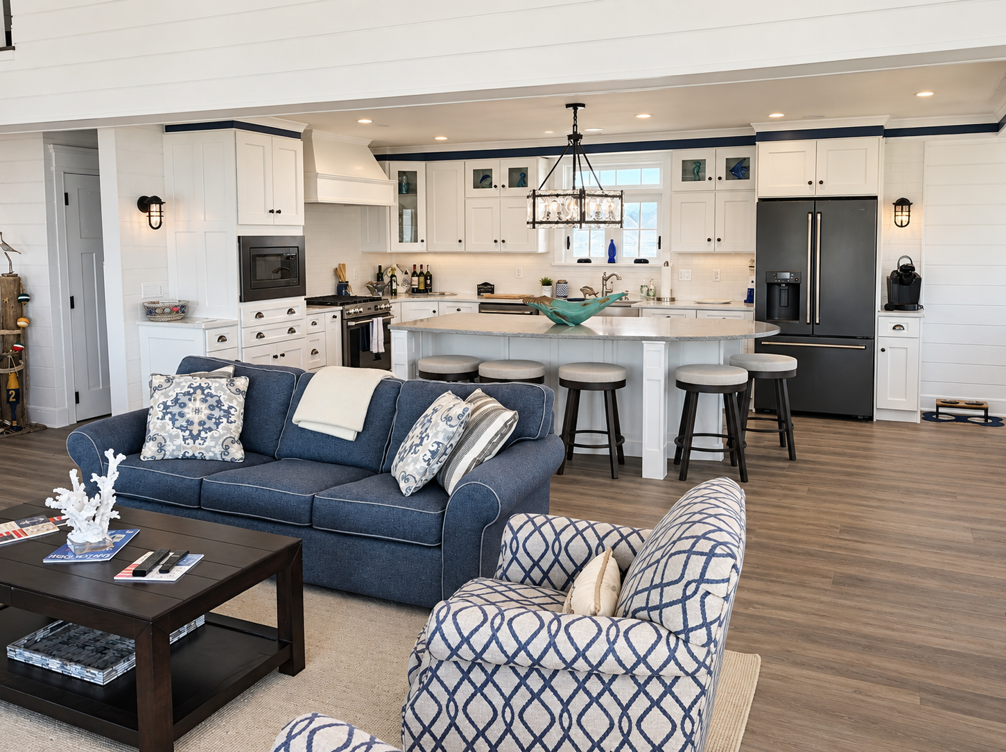 Open kitchen and living area with new flooring in the renovated Sea Isle City duplex
