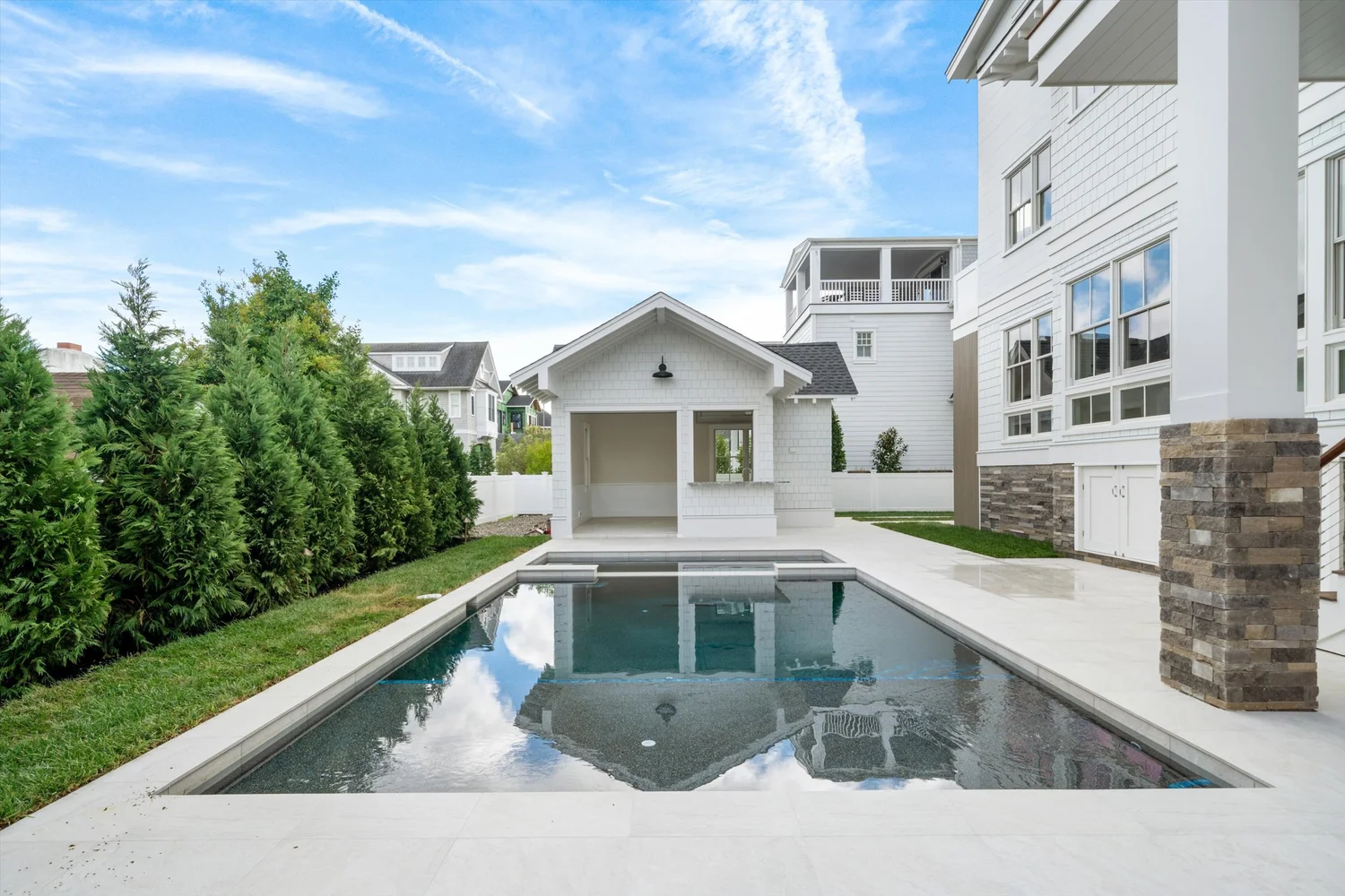 Gunite pool and spillover spa leading to the pool cabana at 245 57th Street, Avalon, NJ