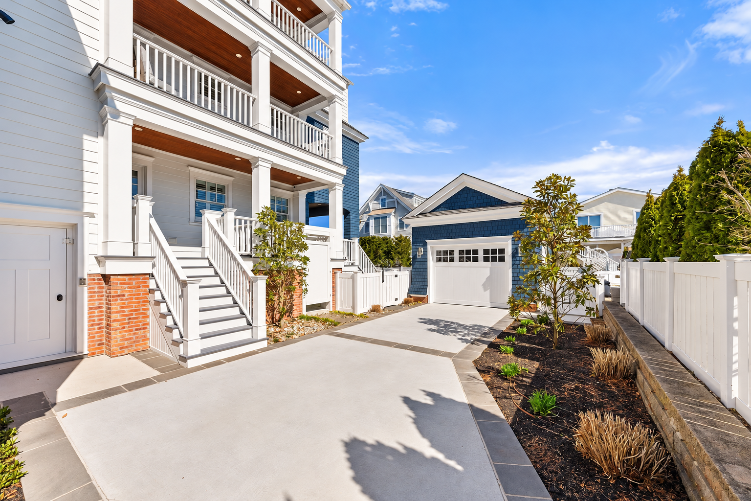 Rear of the home with decks and a detached garage, 213 57th St, Avalon, NJ