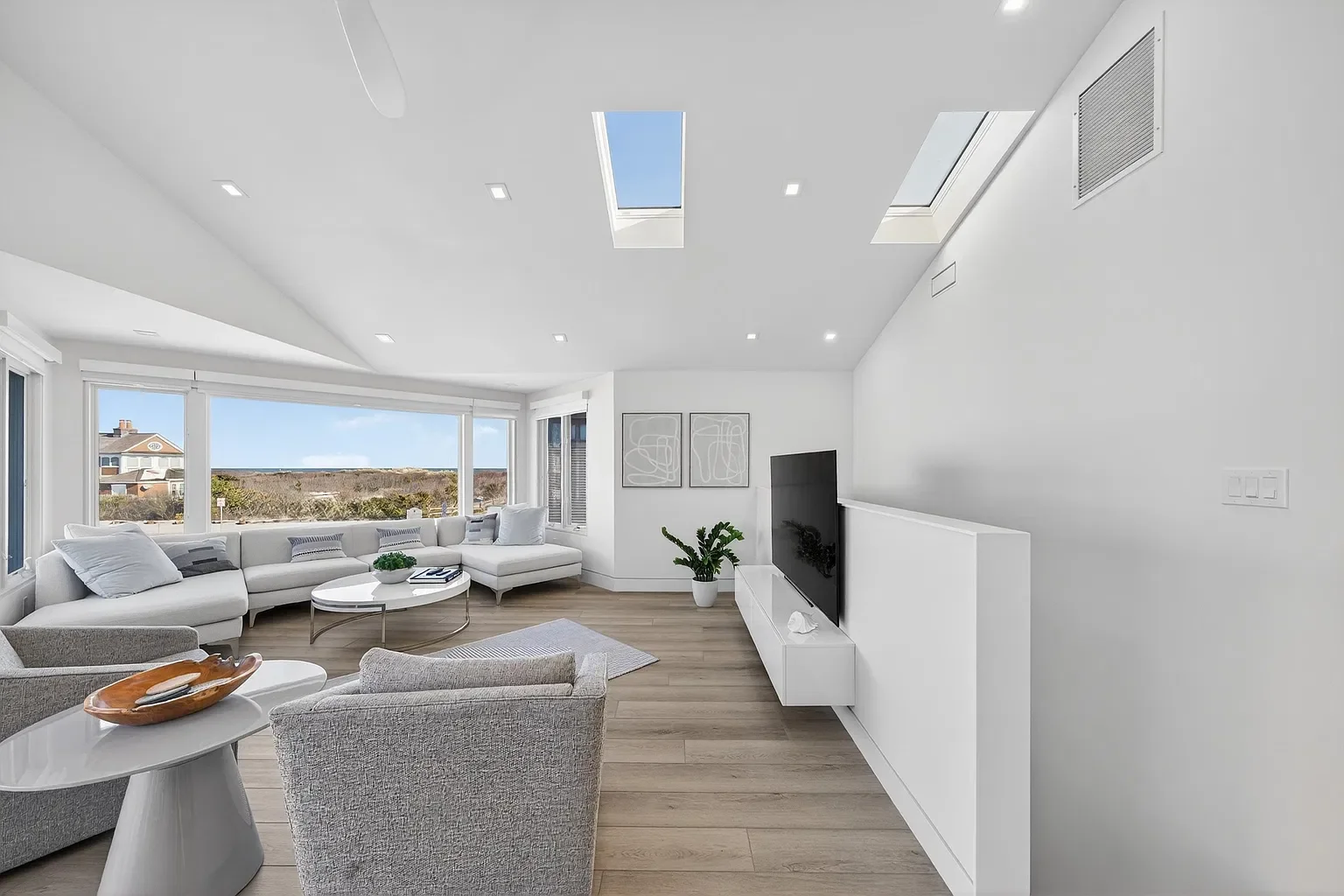 Renovated living room with skylights and new flooring, 107 116th St, Stone Harbor, NJ