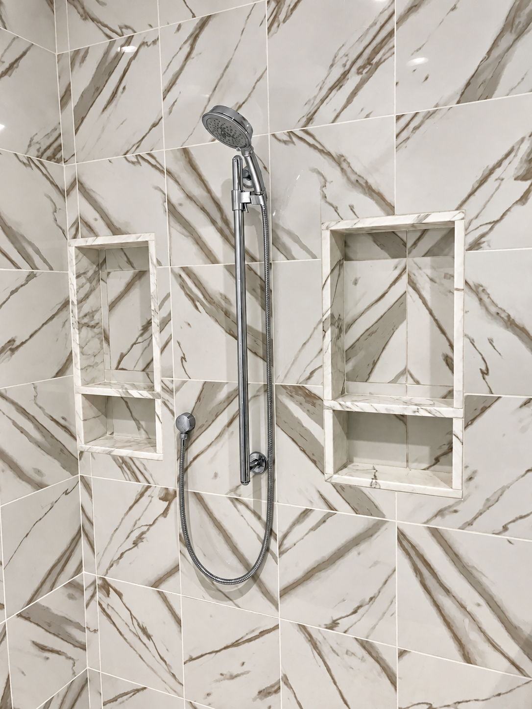 Marble-look shower with built-in niches, Stone Harbor NJ custom home