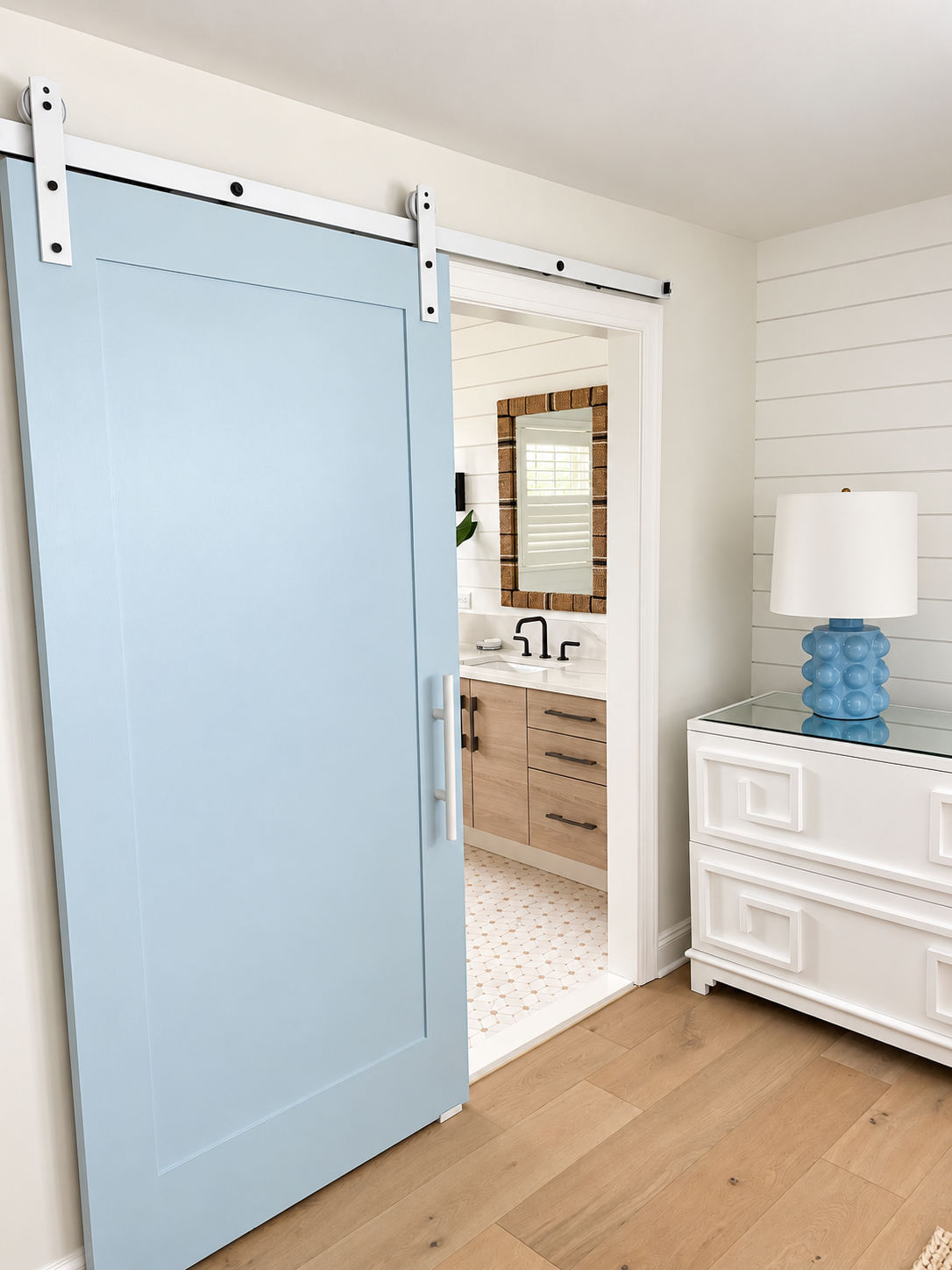 Coastal bedroom with blue barn door to the bathroom, Avalon NJ