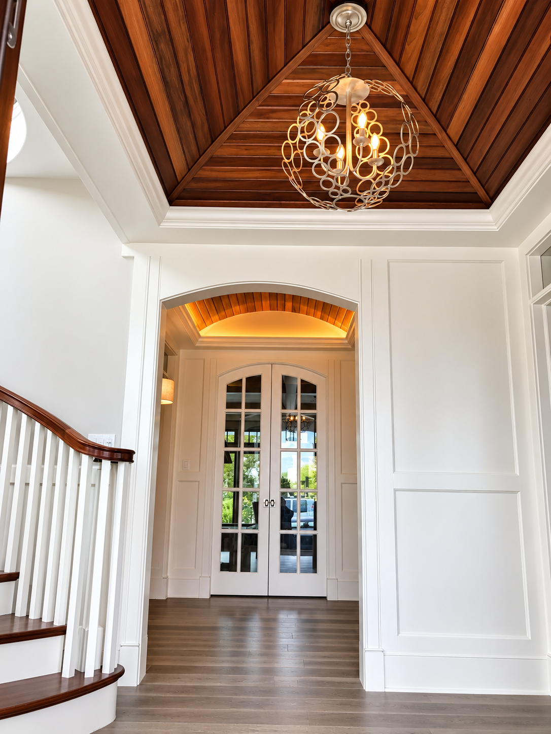 Foyer with wood ceiling, chandelier and arched French doors, Stone Harbor NJ