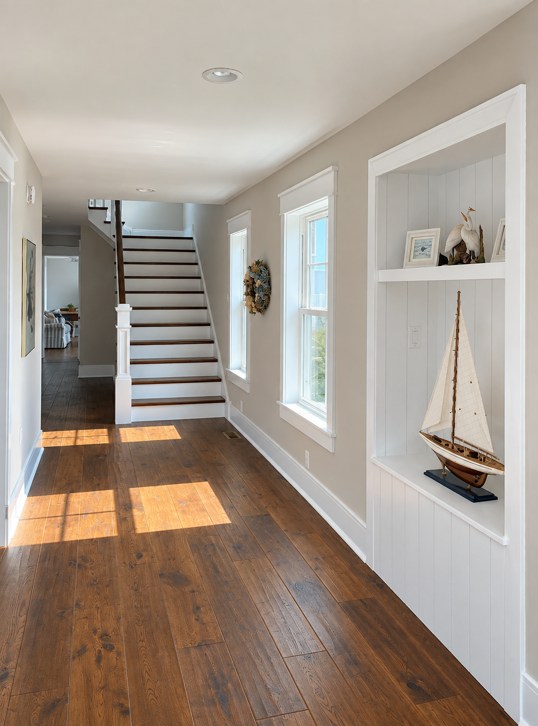 Hallway and staircase with a built-in display niche in a new Avalon, NJ custom home