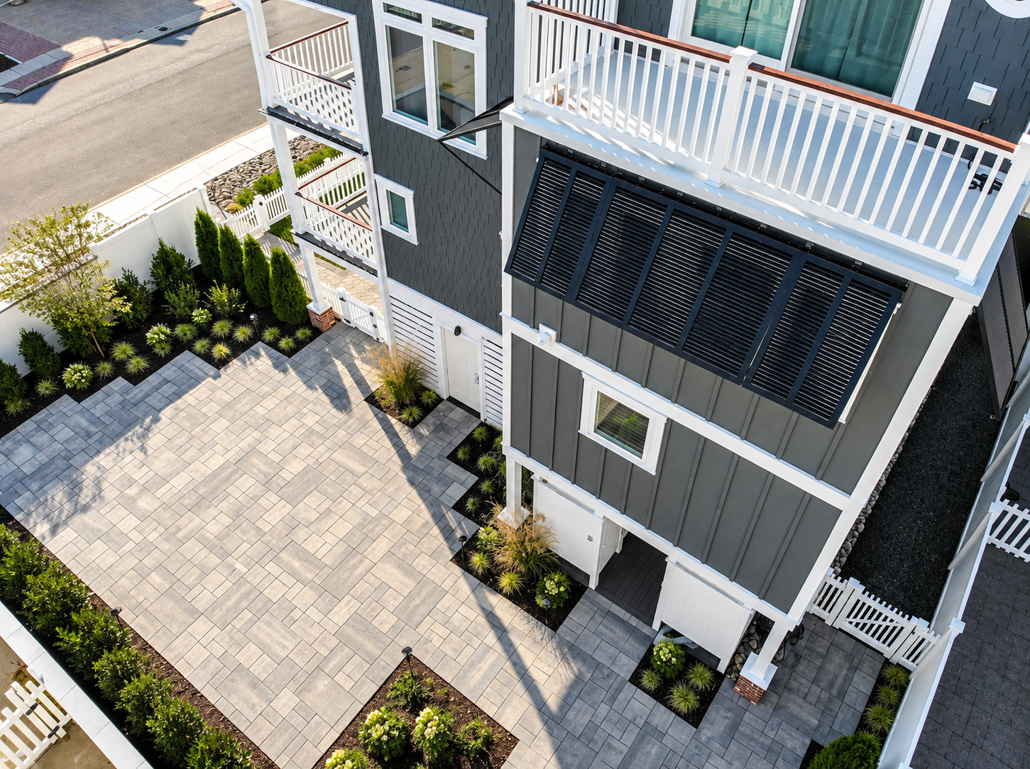 Aerial view of the new paver courtyard and landscaping at the renovated Sea Isle City duplex