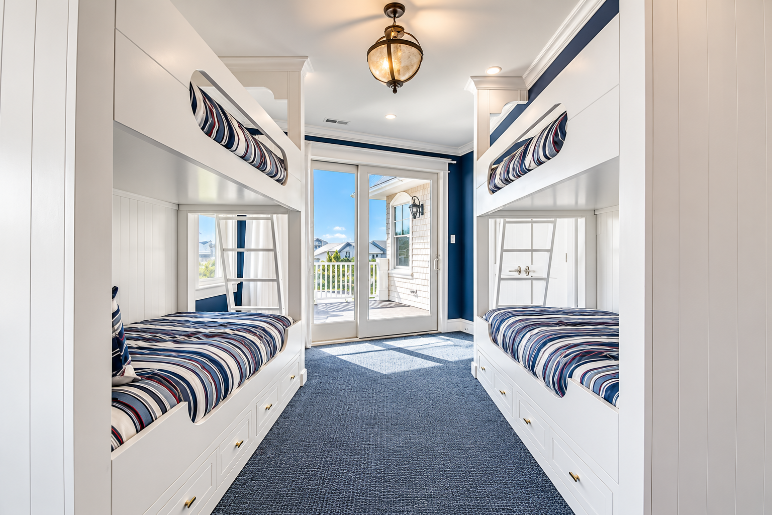 Custom built-in bunk room with balcony doors in a new custom home in Avalon, NJ