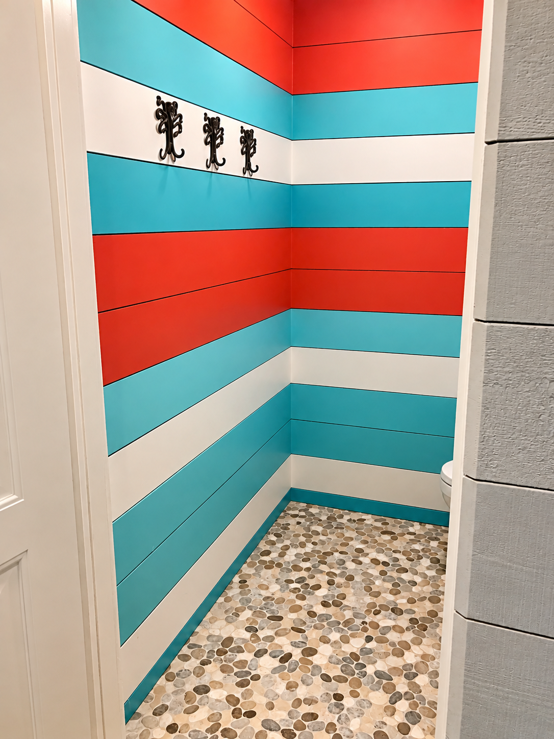 Bathroom with striped walls and pebble floor, Stone Harbor NJ custom home