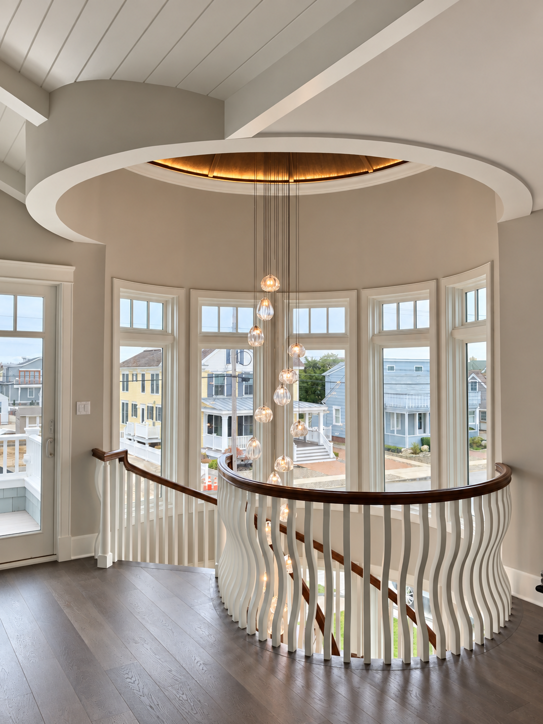 Round stairwell with mahogany ceiling and hand-blown glass chandelier, Stone Harbor NJ