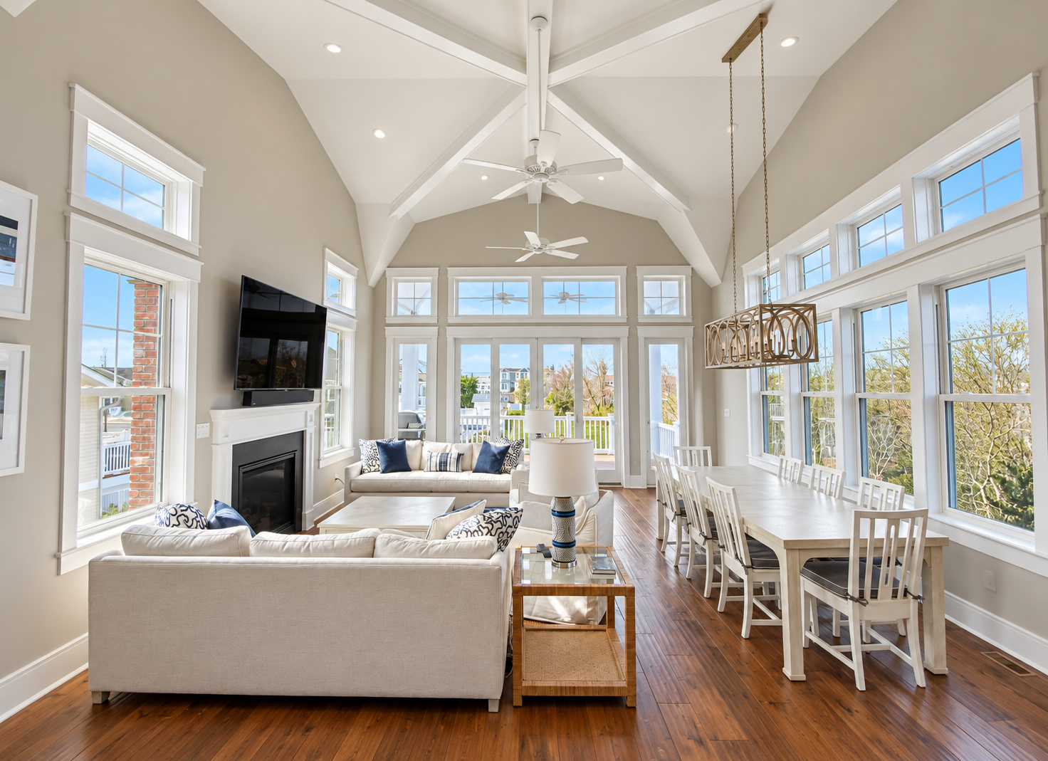 Vaulted great room with living and dining areas in a new custom home in Avalon, NJ