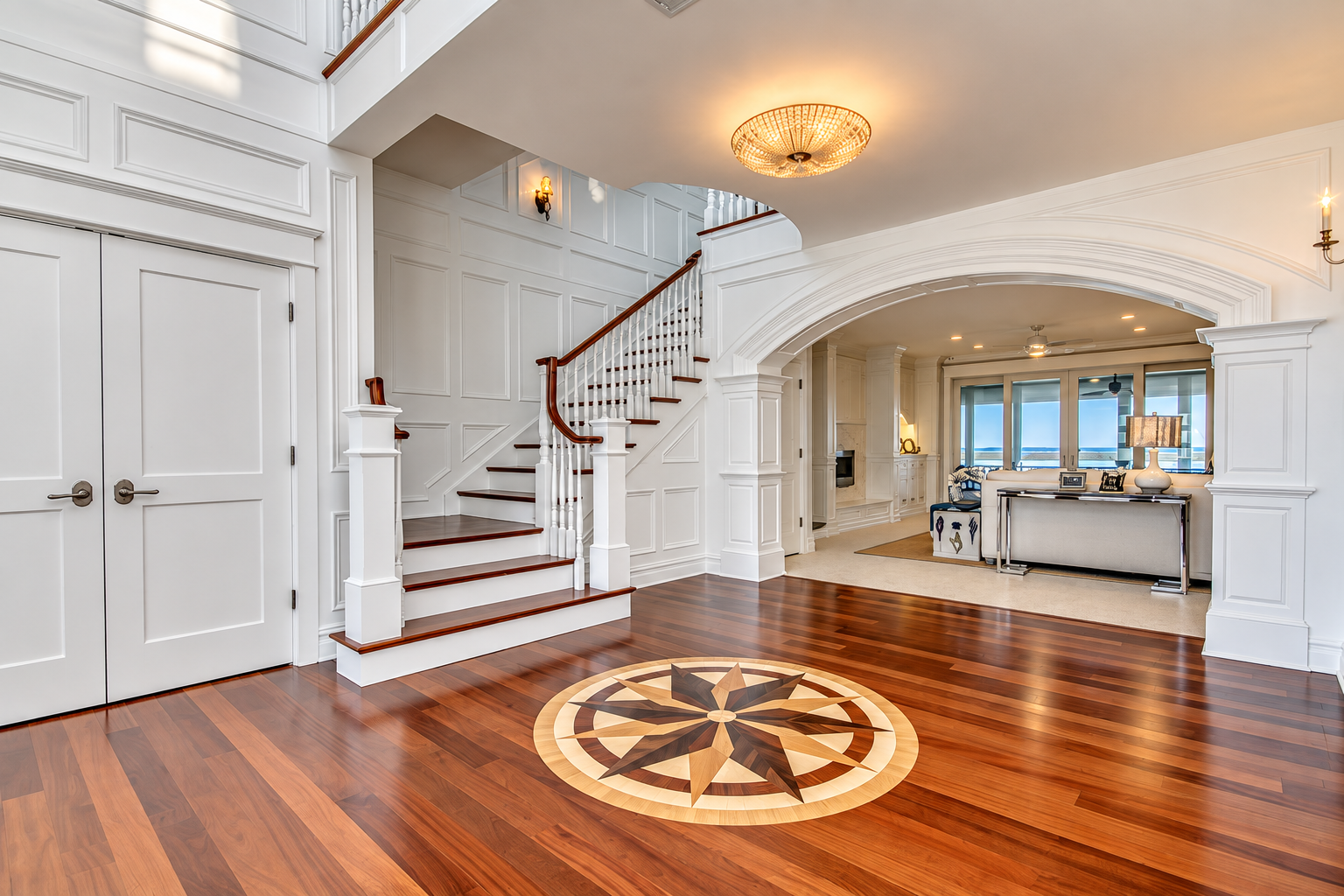 Custom compass inlay at the foot of the staircase in the foyer of a new Avalon, NJ home